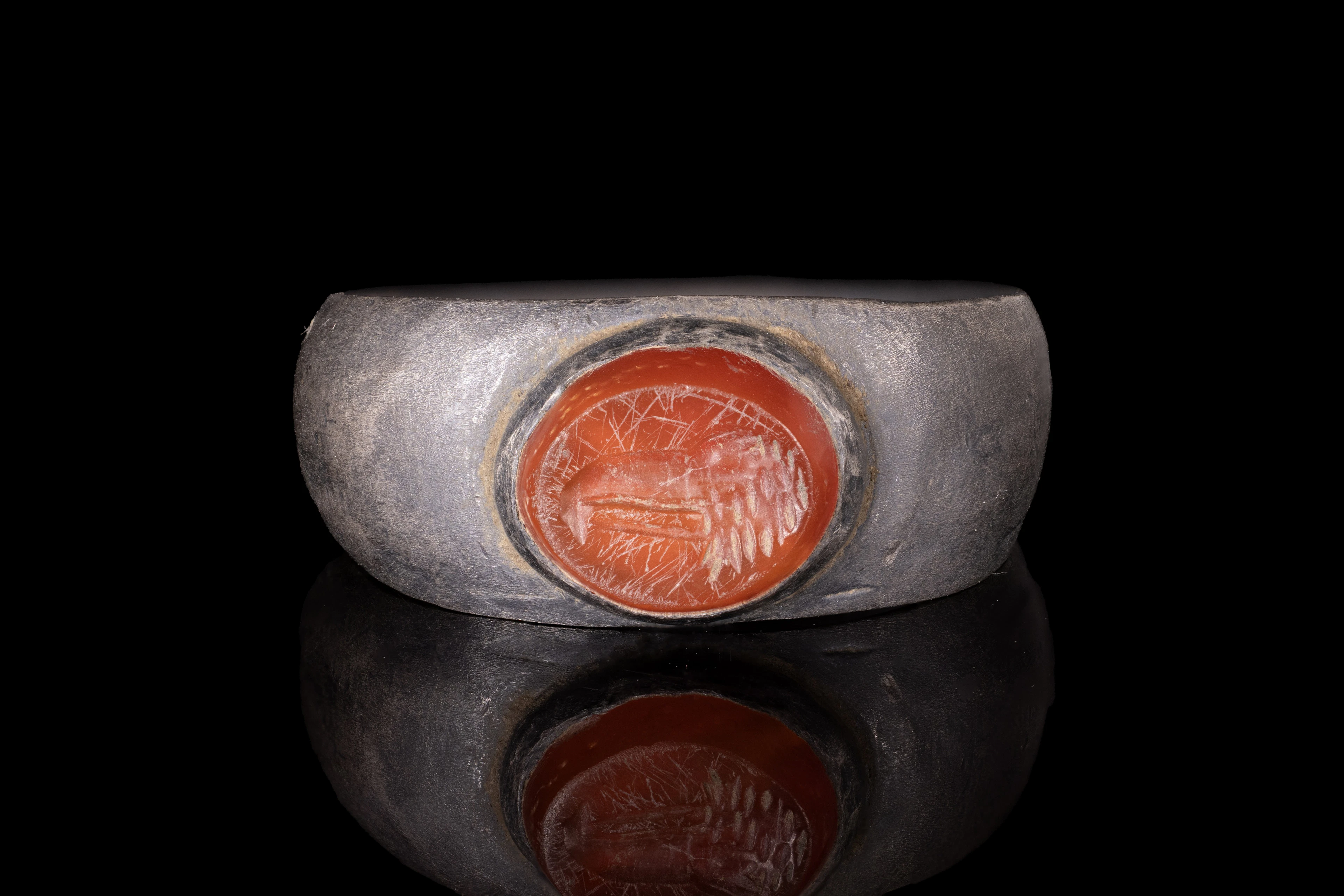 ROMAN CARNELIAN INTAGLIO WITH EAGLE'S HEAD IN SILVER RING
