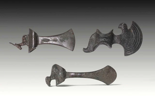 COLLECTION OF BRONZE AGE AXE HEADS WITH ANIMALS