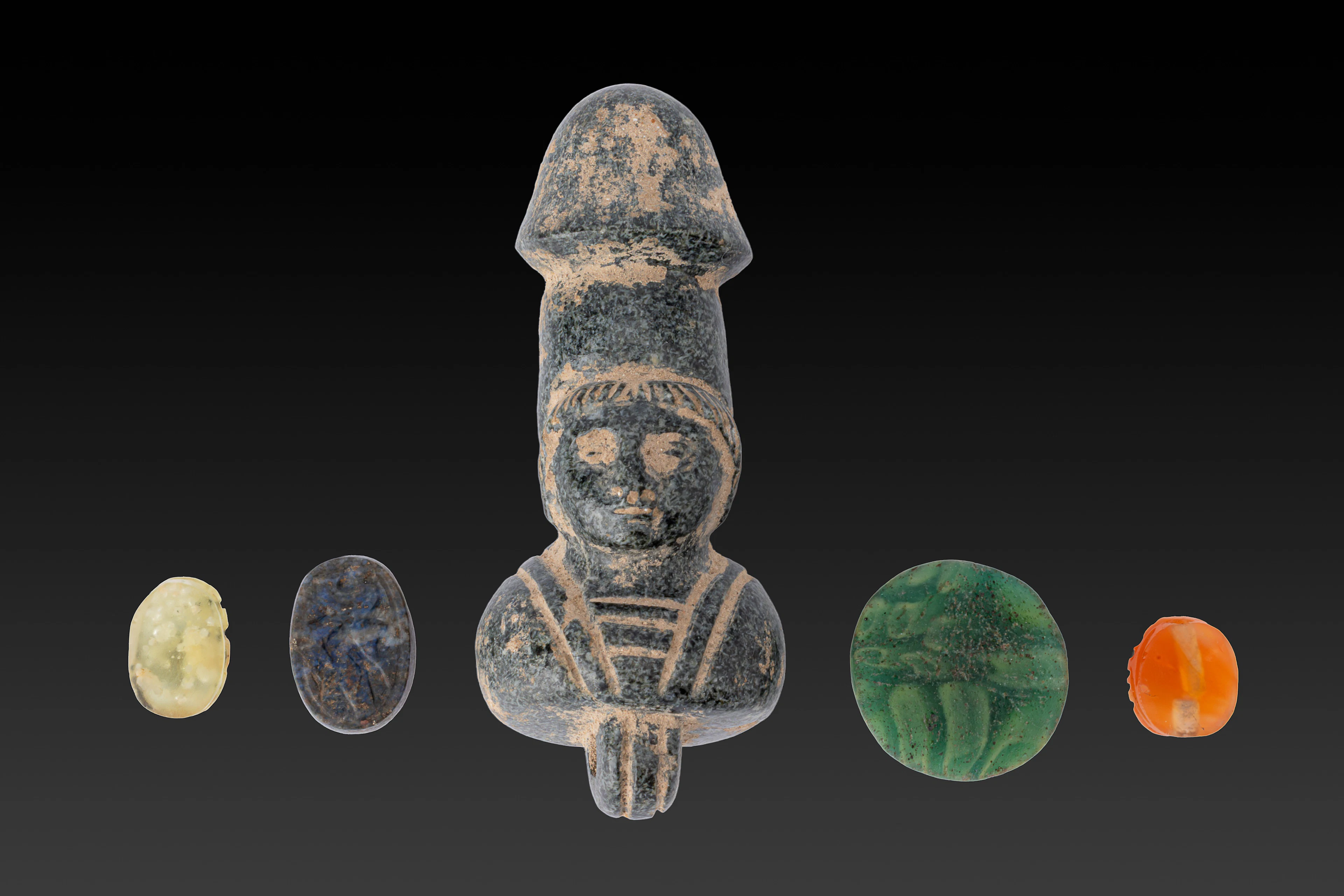 COLLECTION OF ROMAN GLASS AND STONE AMULETS AND BEADS