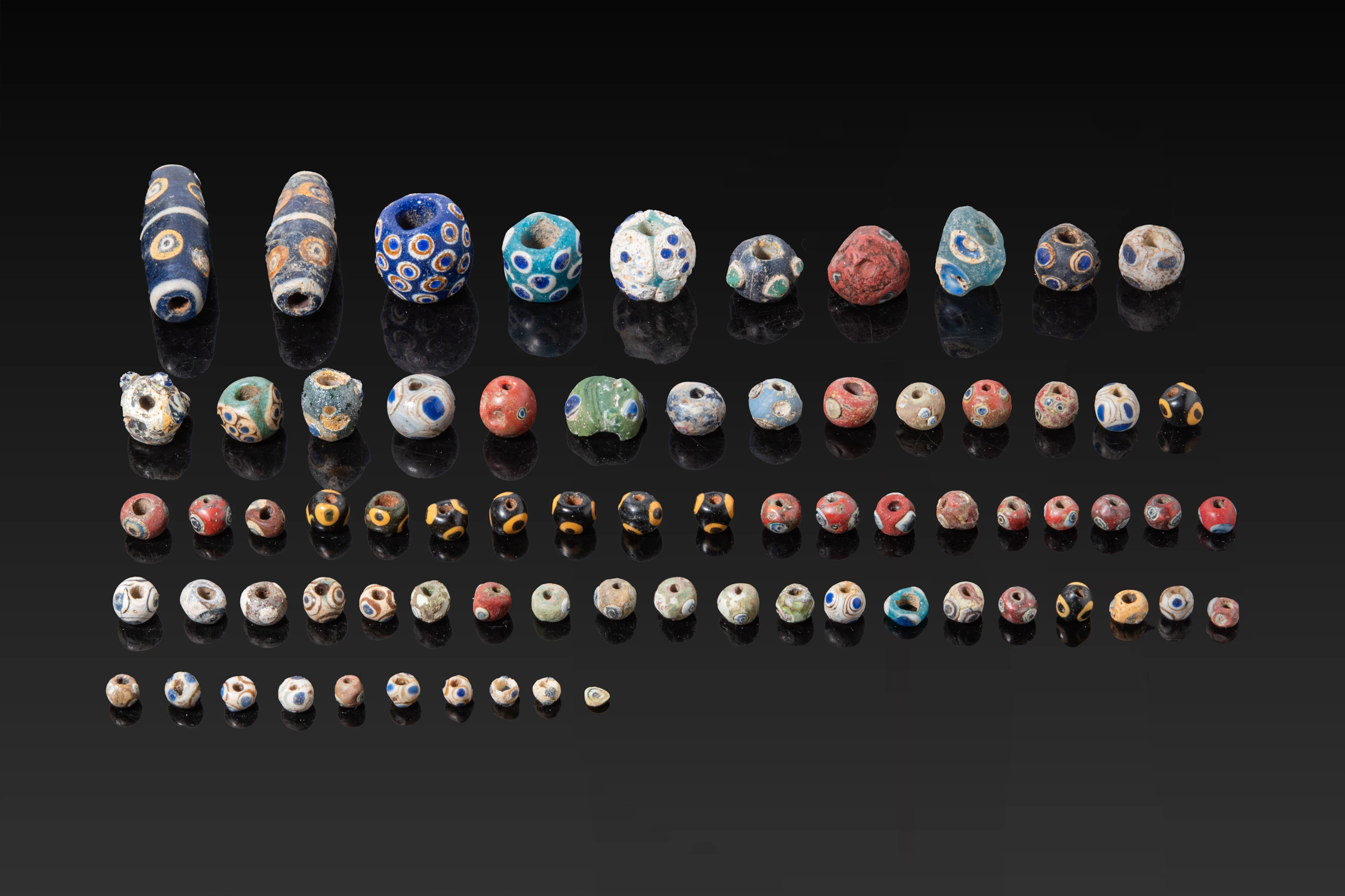 COLLECTION OF PHOENICIAN GLASS EYE BEADS
