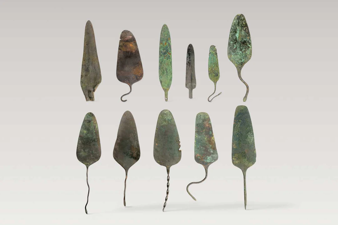 COLLECTION OF BRONZE SPATULAE AND SPEARHEADS