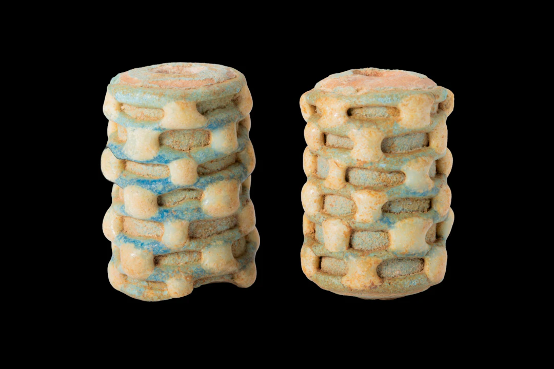 PAIR OF PHOENICIAN GLASS BEADS