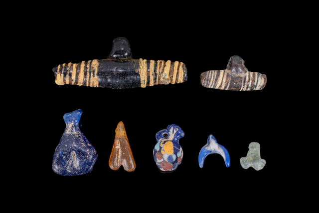 COLLECTION OF GREEK GLASS BEADS AND PENDANTS