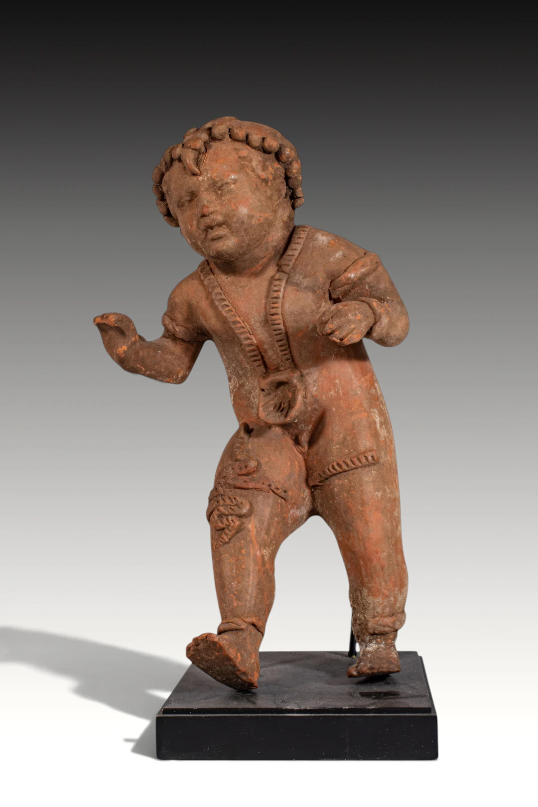 GRAECO-ETRUSCAN POTTERY FIGURINE OF INFANT HERCULES