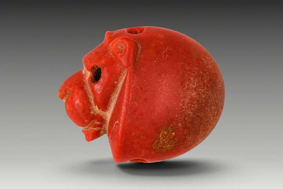 JEMDET NASR RED STONE STAMP SEAL IN THE FORM OF A LION'S HEAD