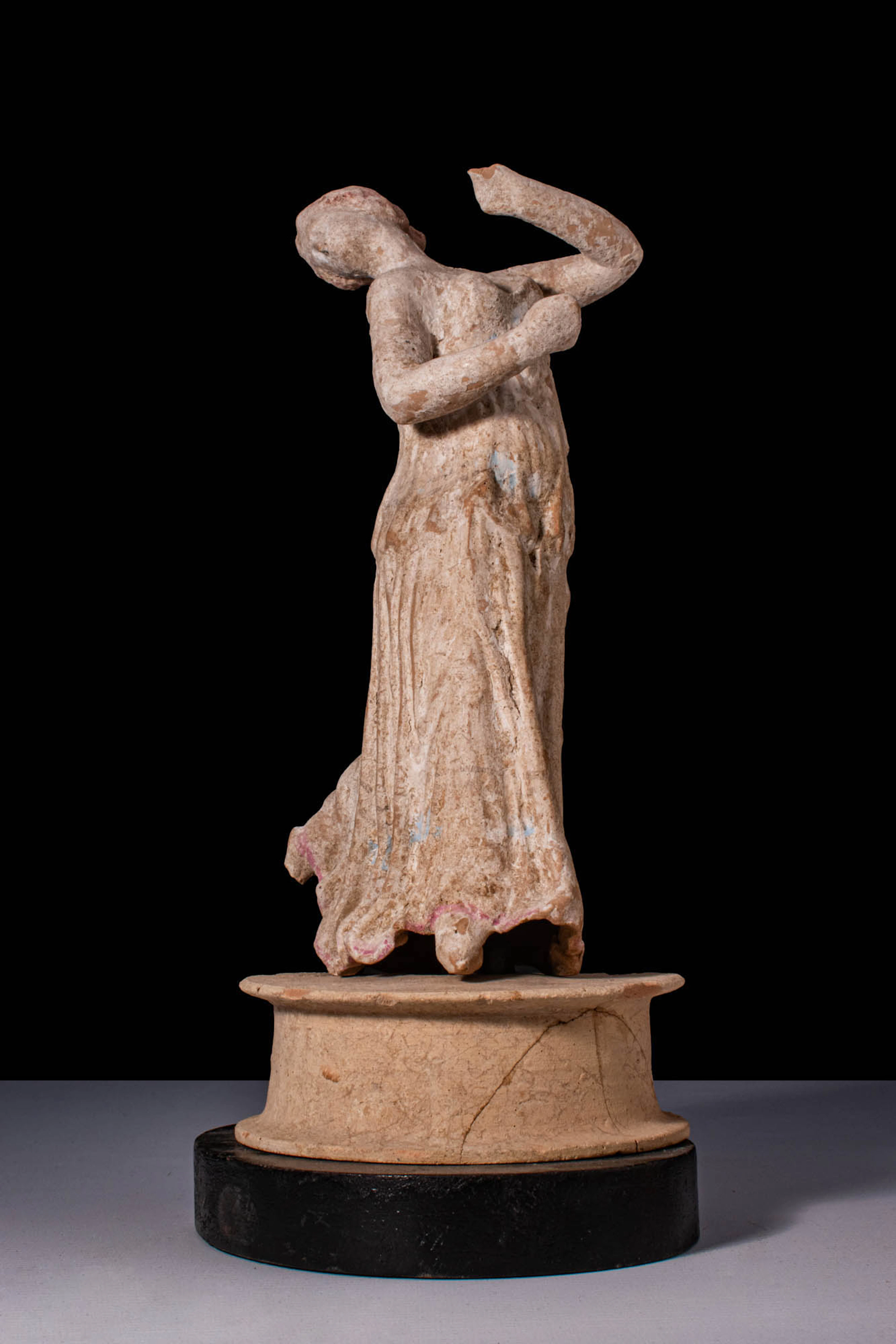 HELLENISTIC TERRACOTTA STATUETTE OF FEMALE DANCER - EX. CHRISTIE'S