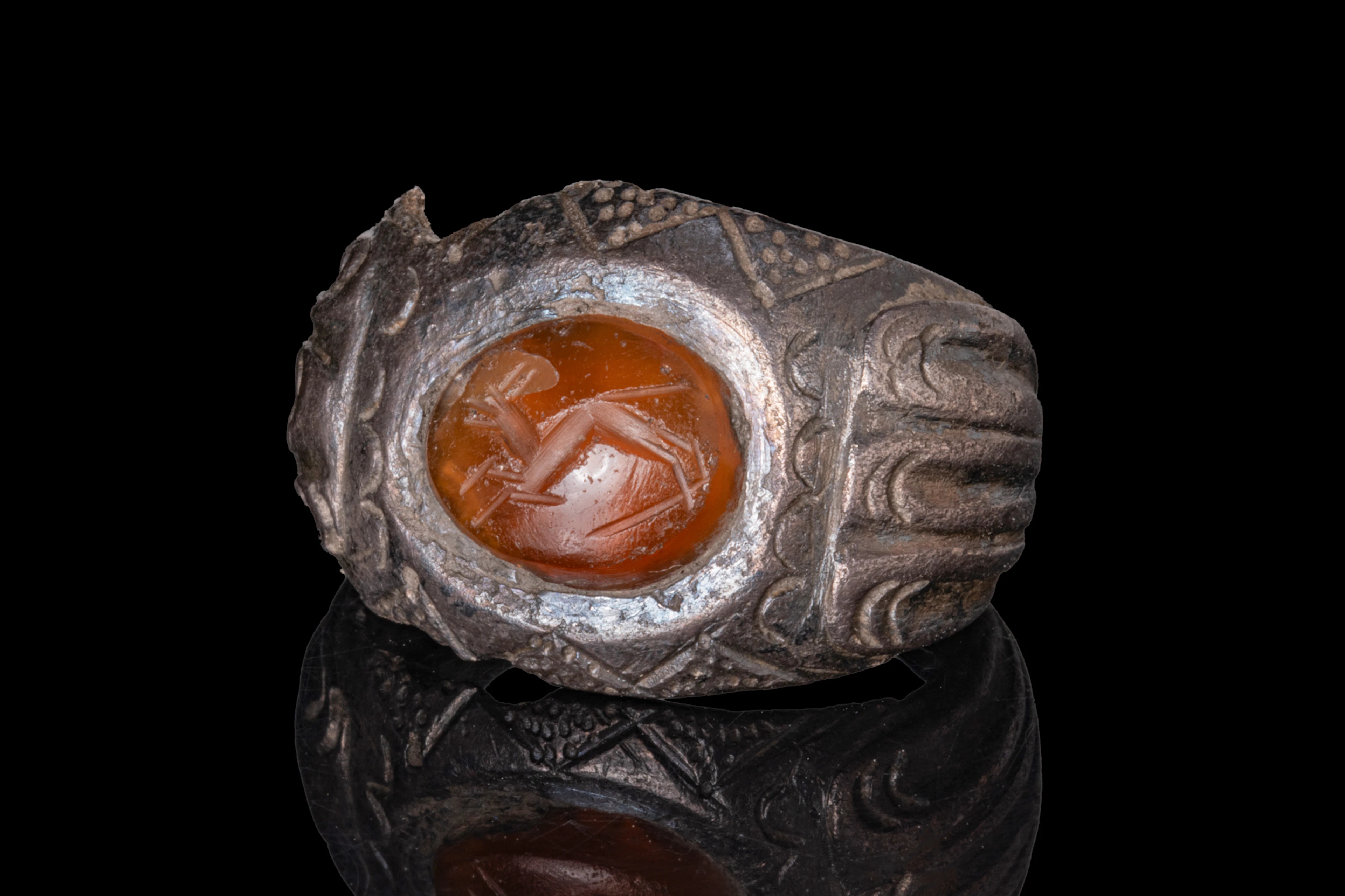 ROMAN SILVER ALLOY RING WITH CARNELIAN INTAGLIO OF A QUADRUPED