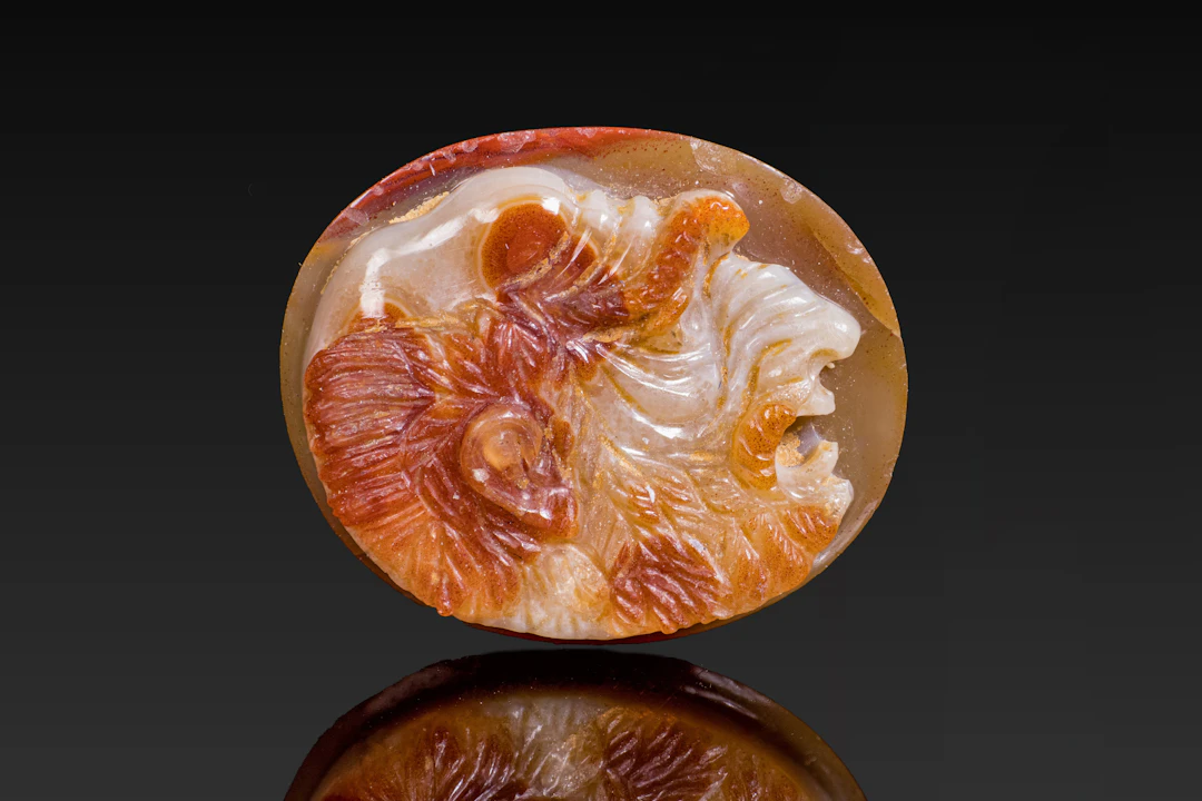 ROMAN AGATE CAMEO OF A GROTESQUE BEARDED MALE HEAD