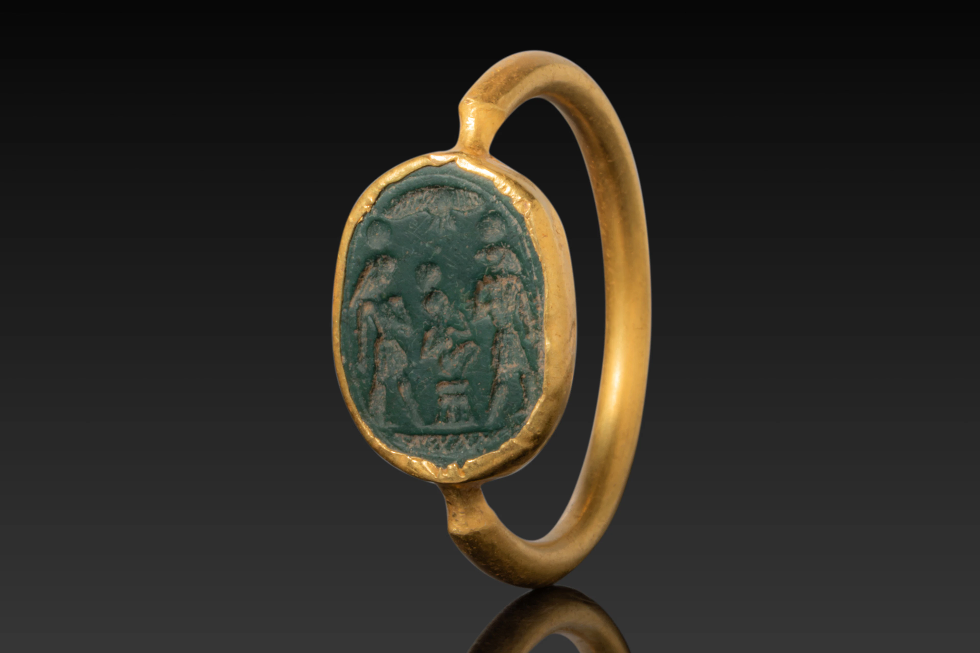 EGYPTIAN GREEN JASPER INTAGLIO OF HARPOCRATES ON LOTUS FLANKED BY