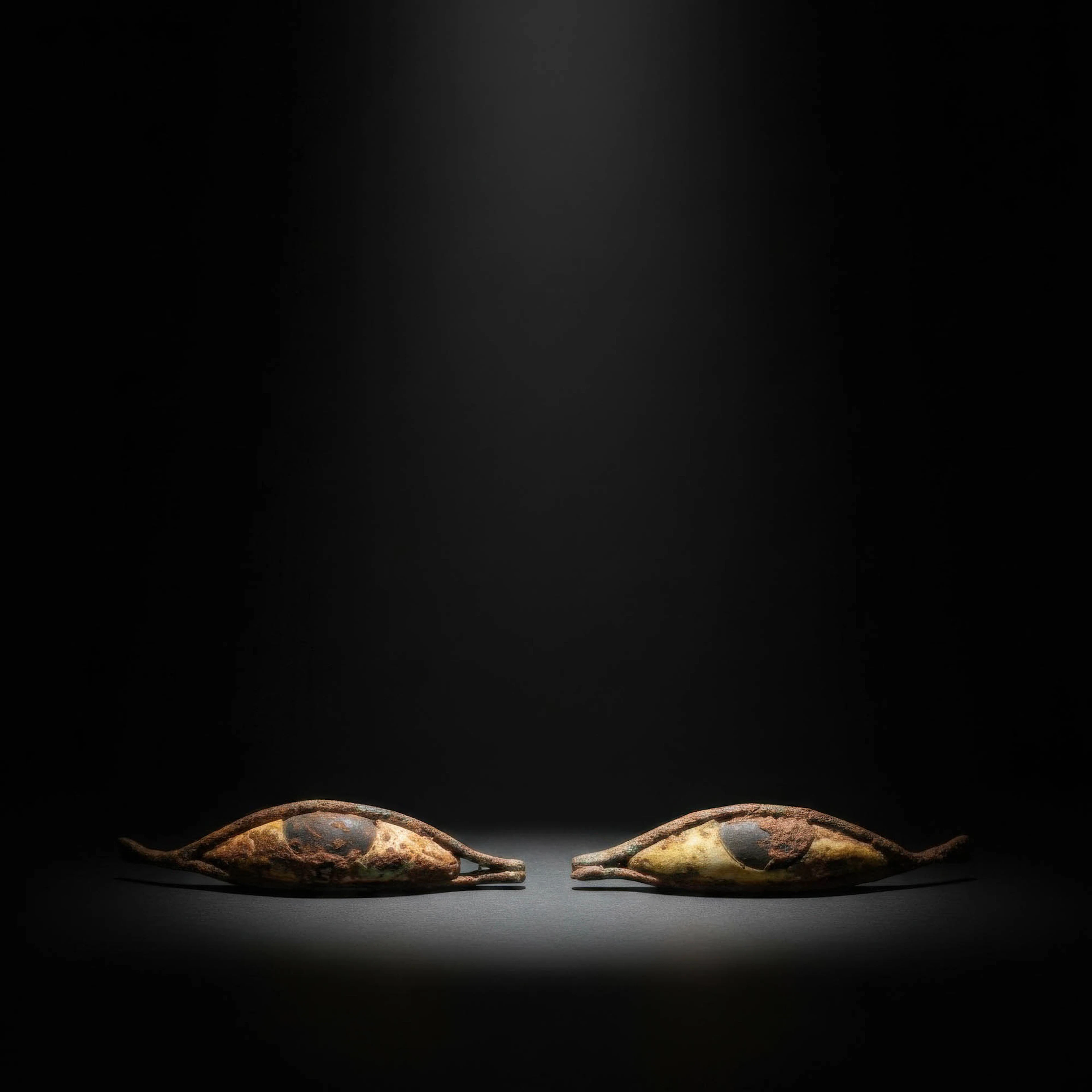 PAIR OF EGYPTIAN BRONZE AND STONE EYES