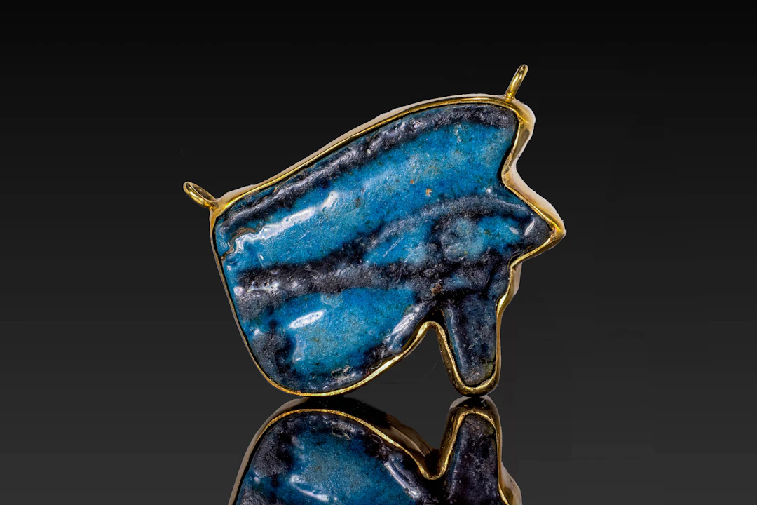 EGYPTIAN BLUE FAIENCE WEDJAT AMULET IN 18K GOLD PENDANT