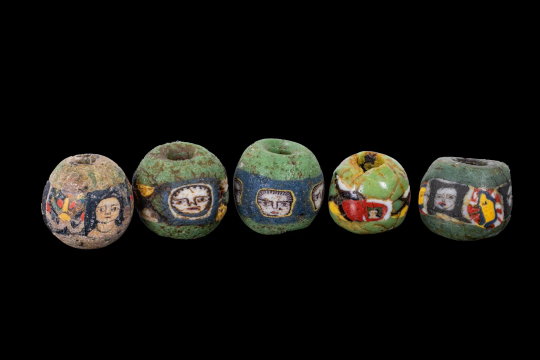 COLLECTION OF ROMAN MOSAIC GLASS BEADS WITH FACES