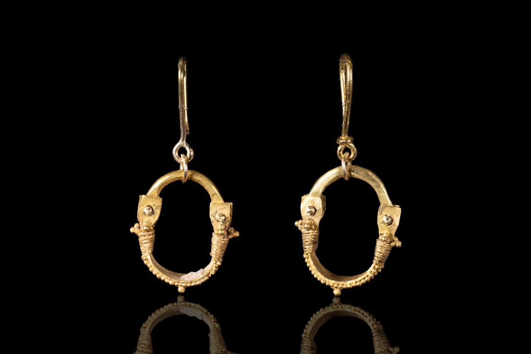 MATCHED PAIR OF GREEK GOLD BOAT-SHAPED EARRINGS WITH GRANULATION