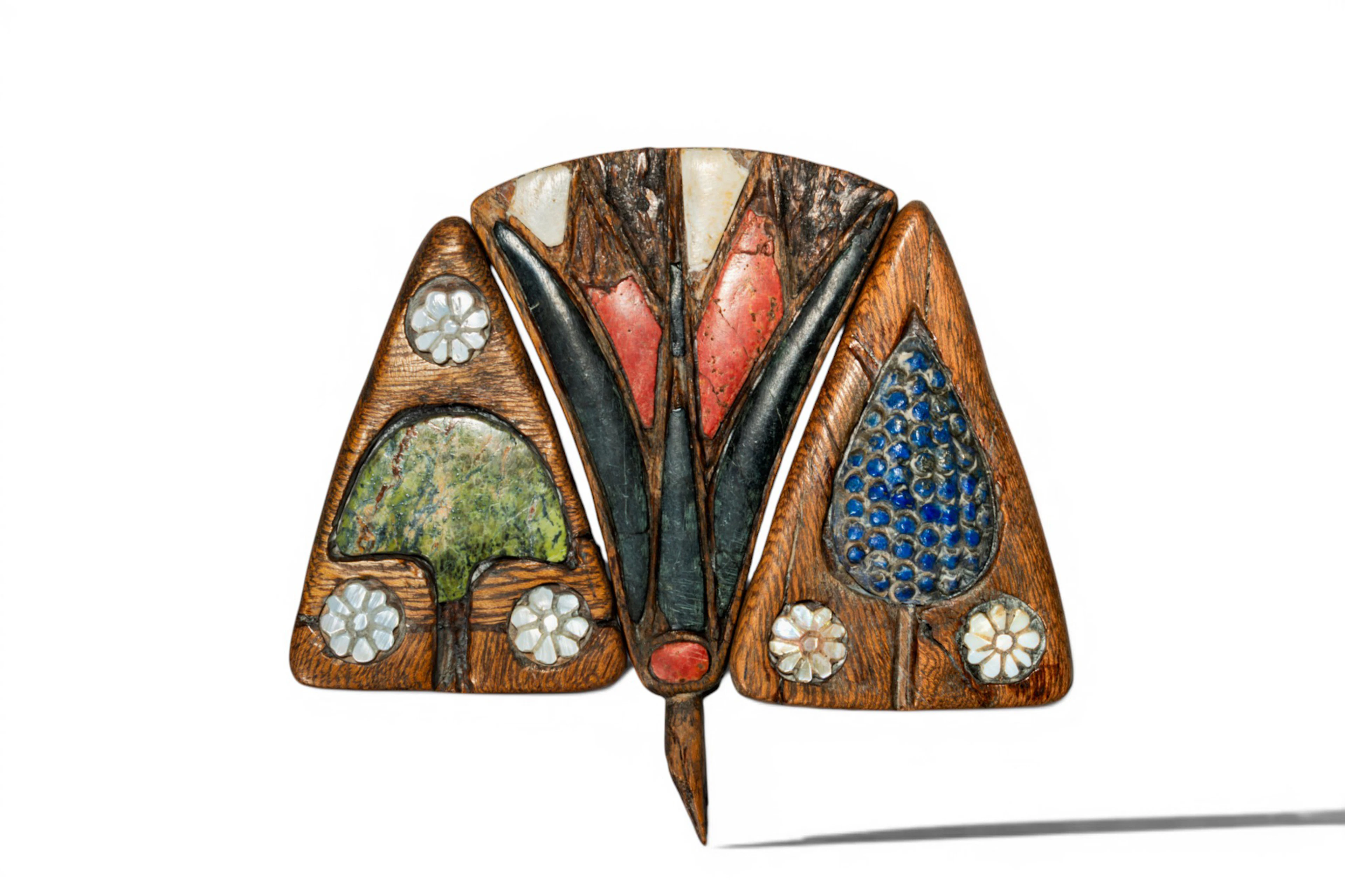 COLLECTION OF EGYPTIAN STONE-INLAID WOOD FLOWER ORNAMENTS