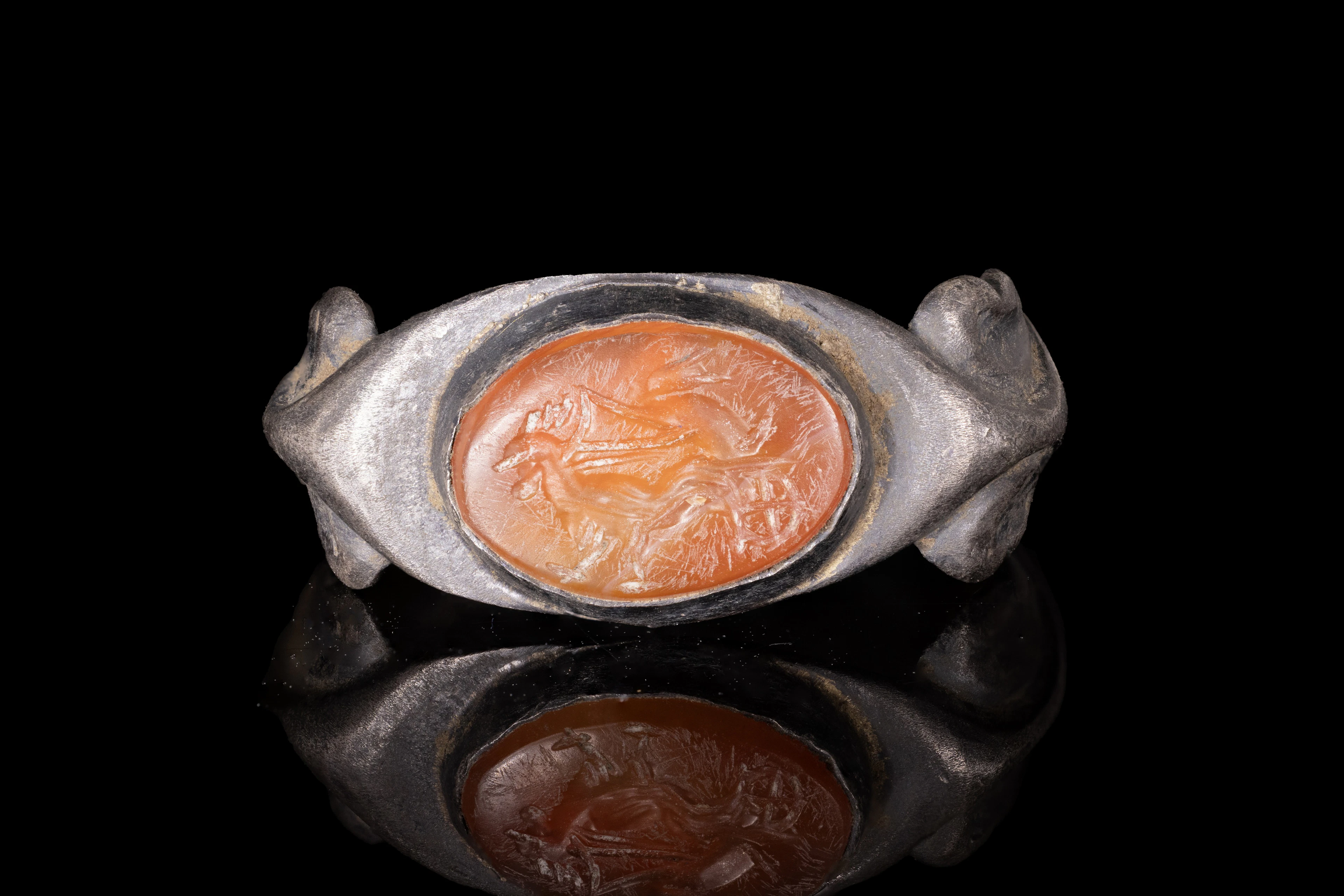ROMAN CARNELIAN INTAGLIO WITH EROS DRIVING A CHARIOT DRAWN BY ROOSTERS