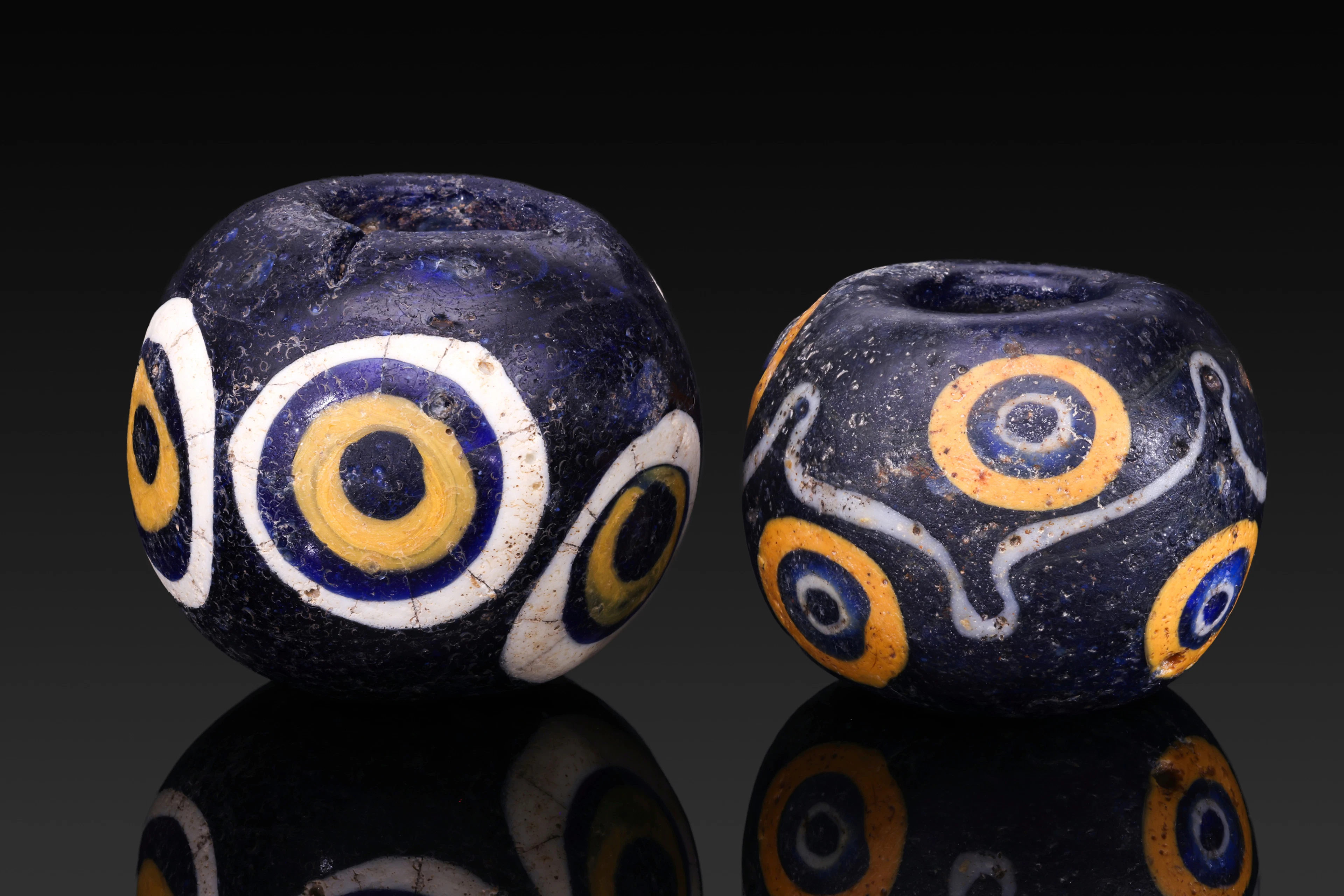 PAIR OF MASSIVE PHOENICIAN GLASS EYE BEADS
