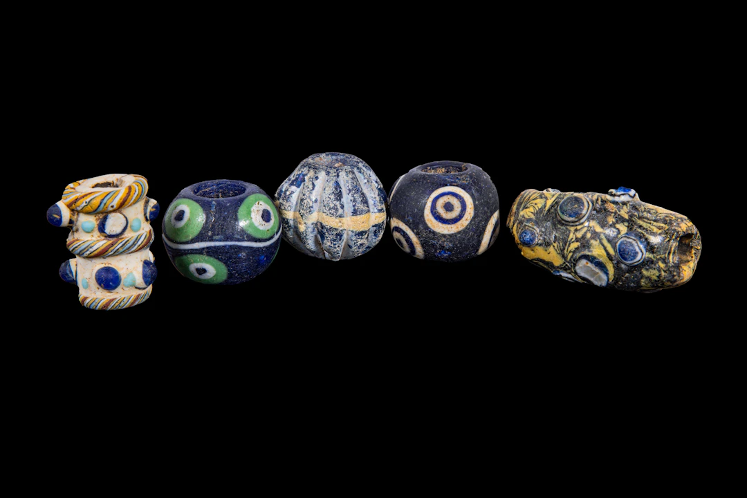 COLLECTION OF LARGE PHOENICIAN POLYCHROME GLASS BEADS
