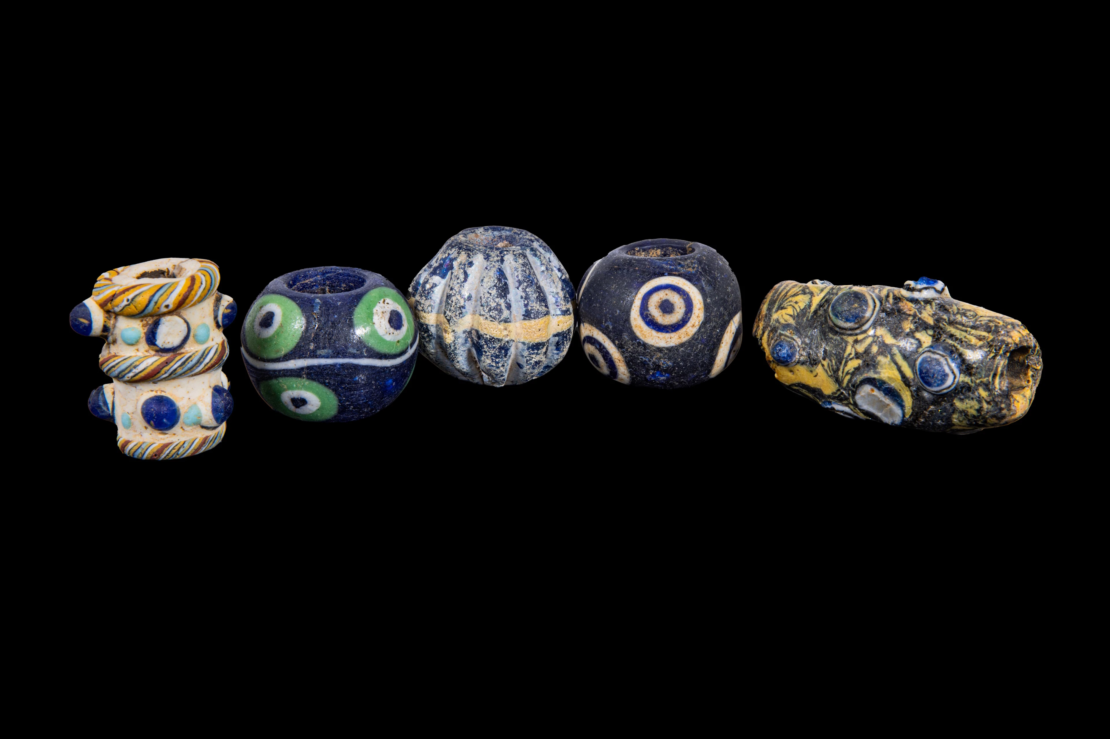 COLLECTION OF LARGE PHOENICIAN POLYCHROME GLASS BEADS
