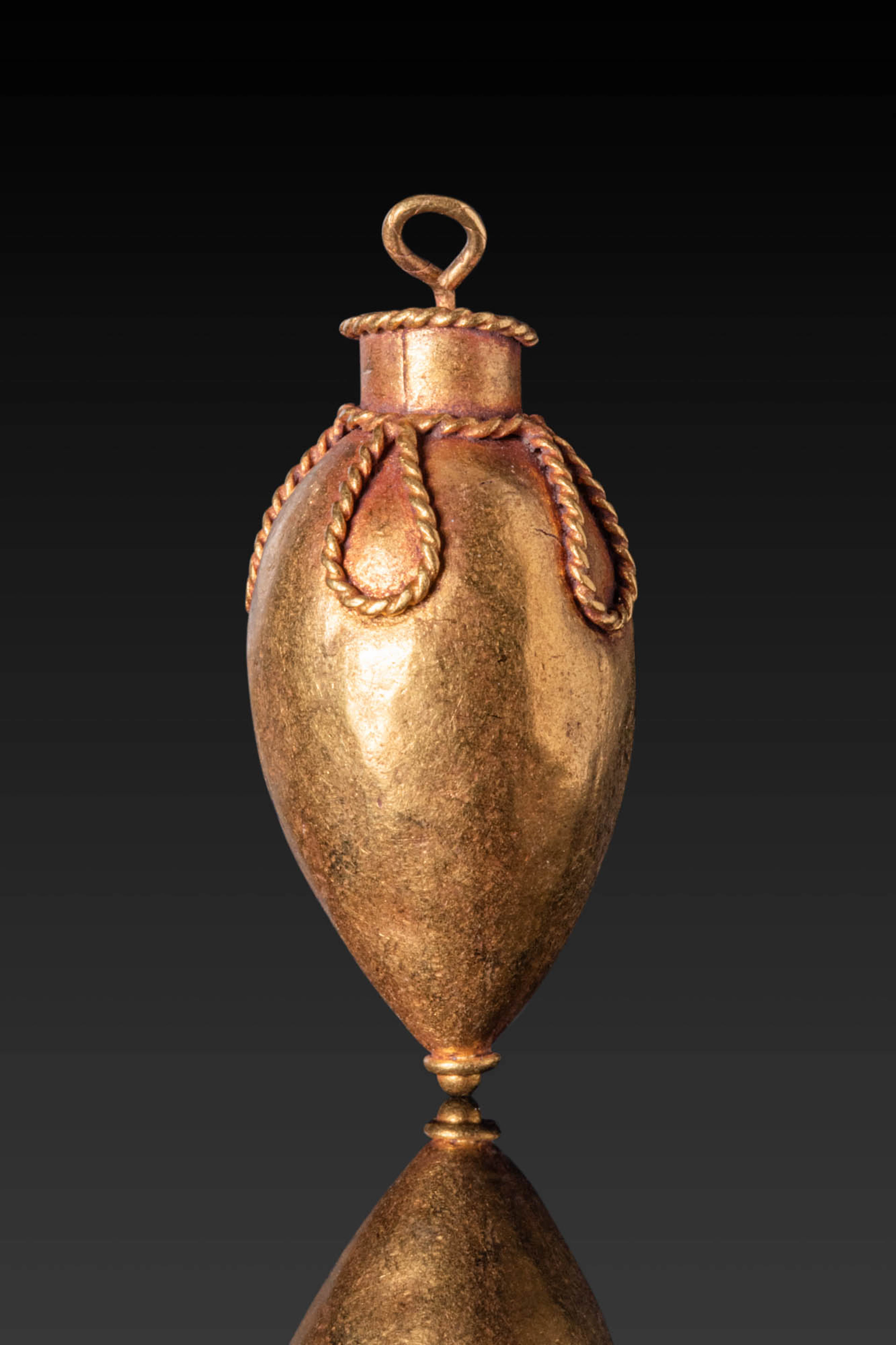 HELLENISTIC HIGH KARAT GOLD VESSEL-SHAPED PENDANT FROM AN EARRING