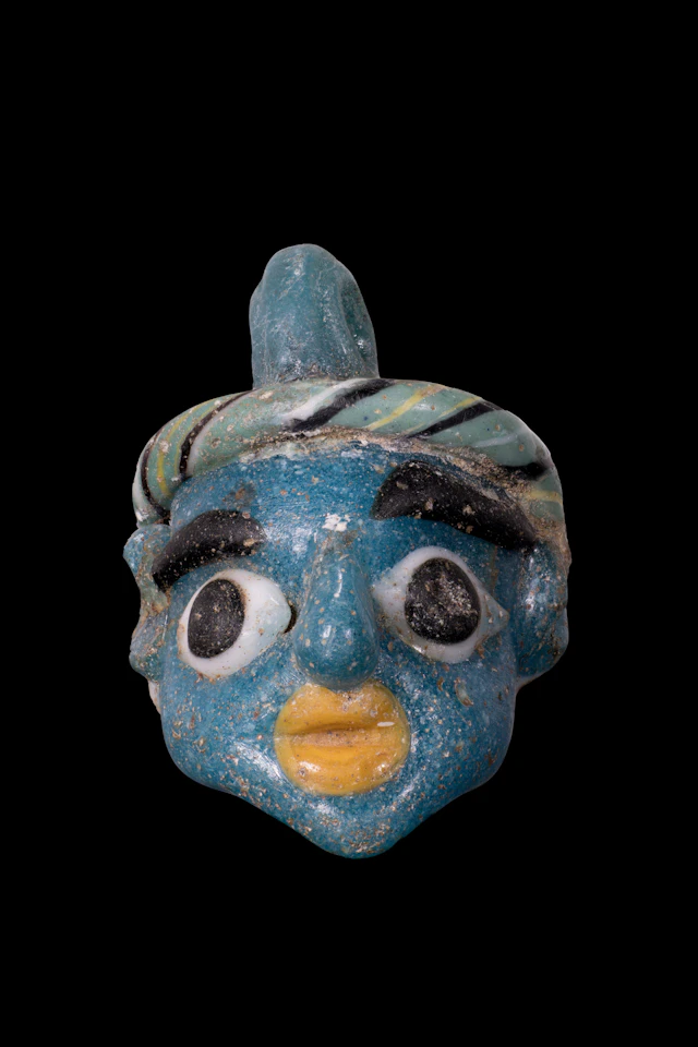 GRAECO-PHOENICIAN POLYCHROME GLASS FACE BEAD