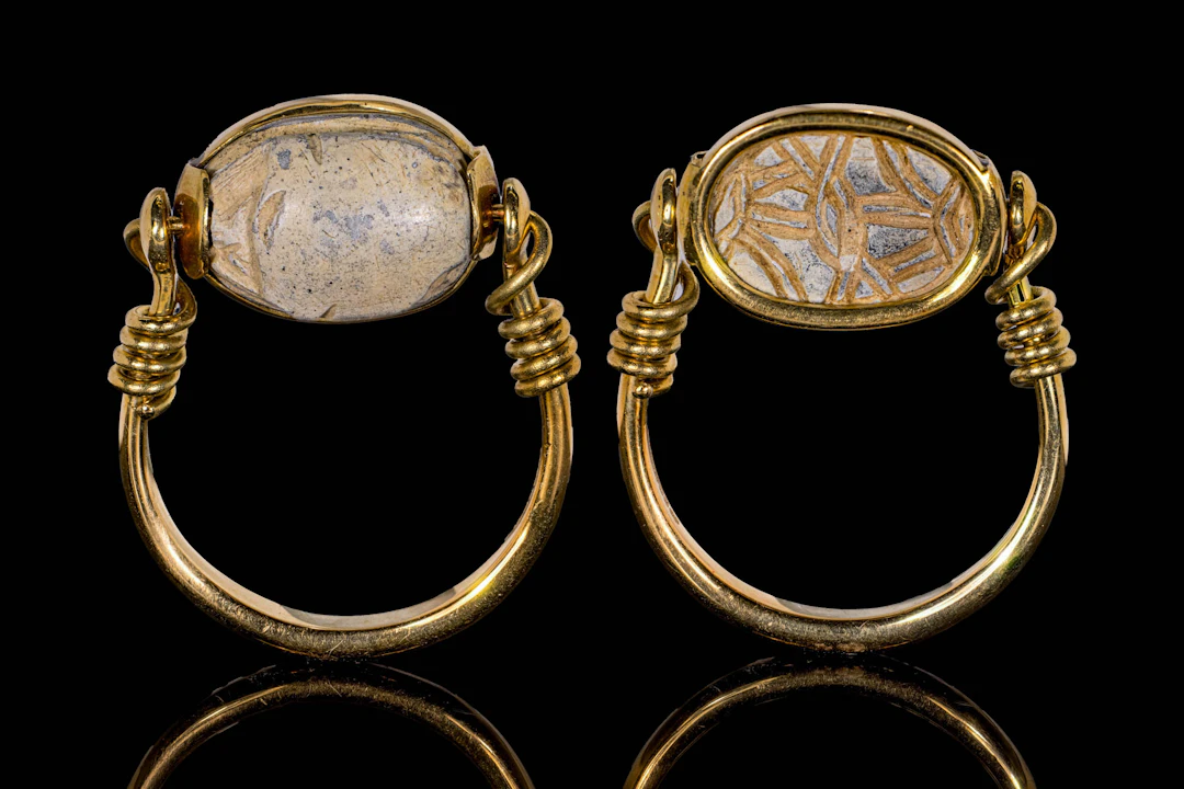 EGYPTIAN STEATITE SCARAB WITH INTERLACED PATTERN IN SWIVEL GOLD RING