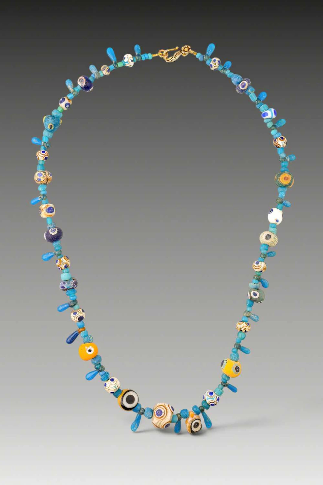STUNNING LATE GRAECO-PHOENICIAN NECKLACE WITH POLYCHROME GLASS EYE