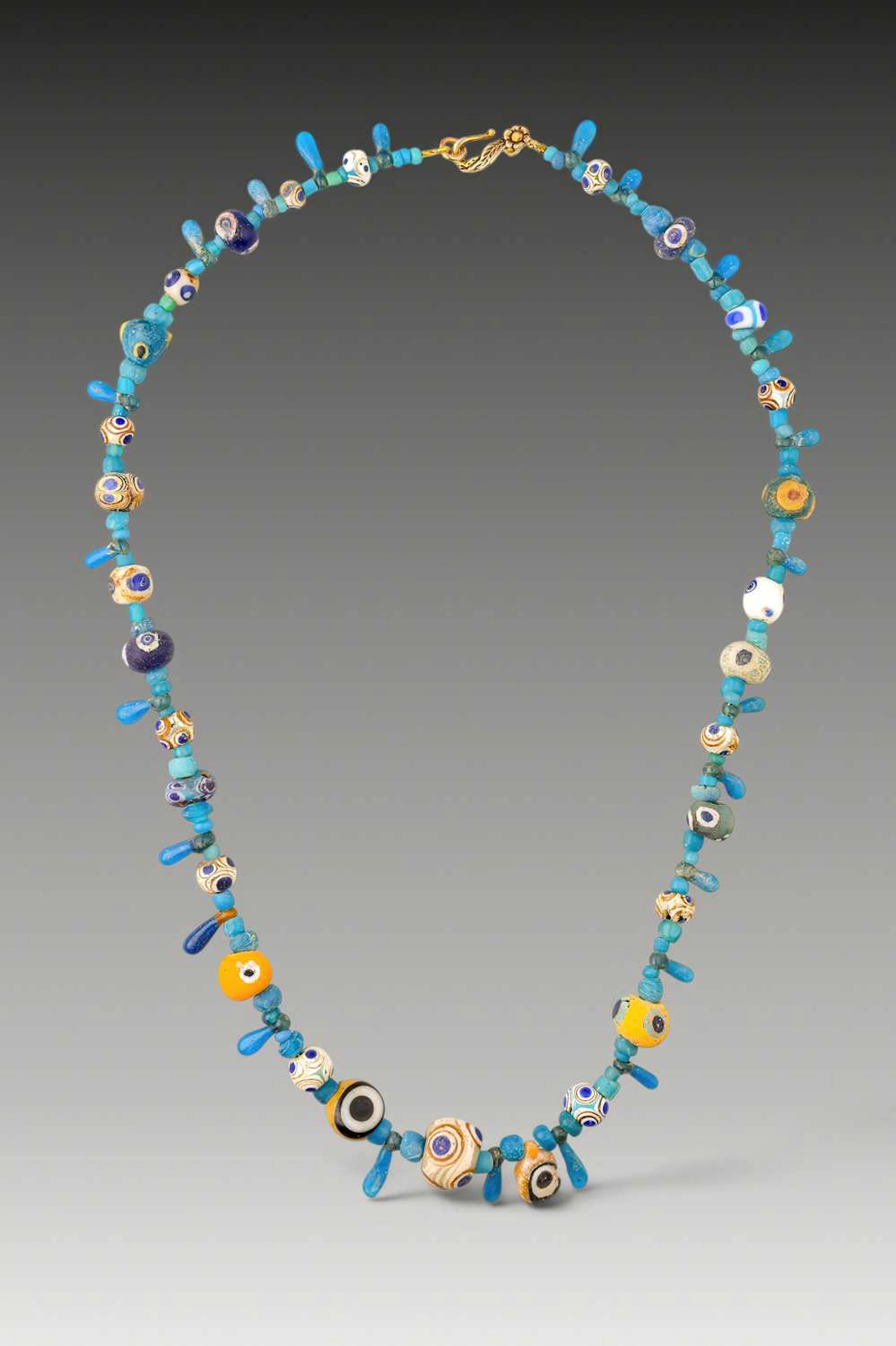 STUNNING LATE GRAECO-PHOENICIAN NECKLACE WITH POLYCHROME GLASS EYE