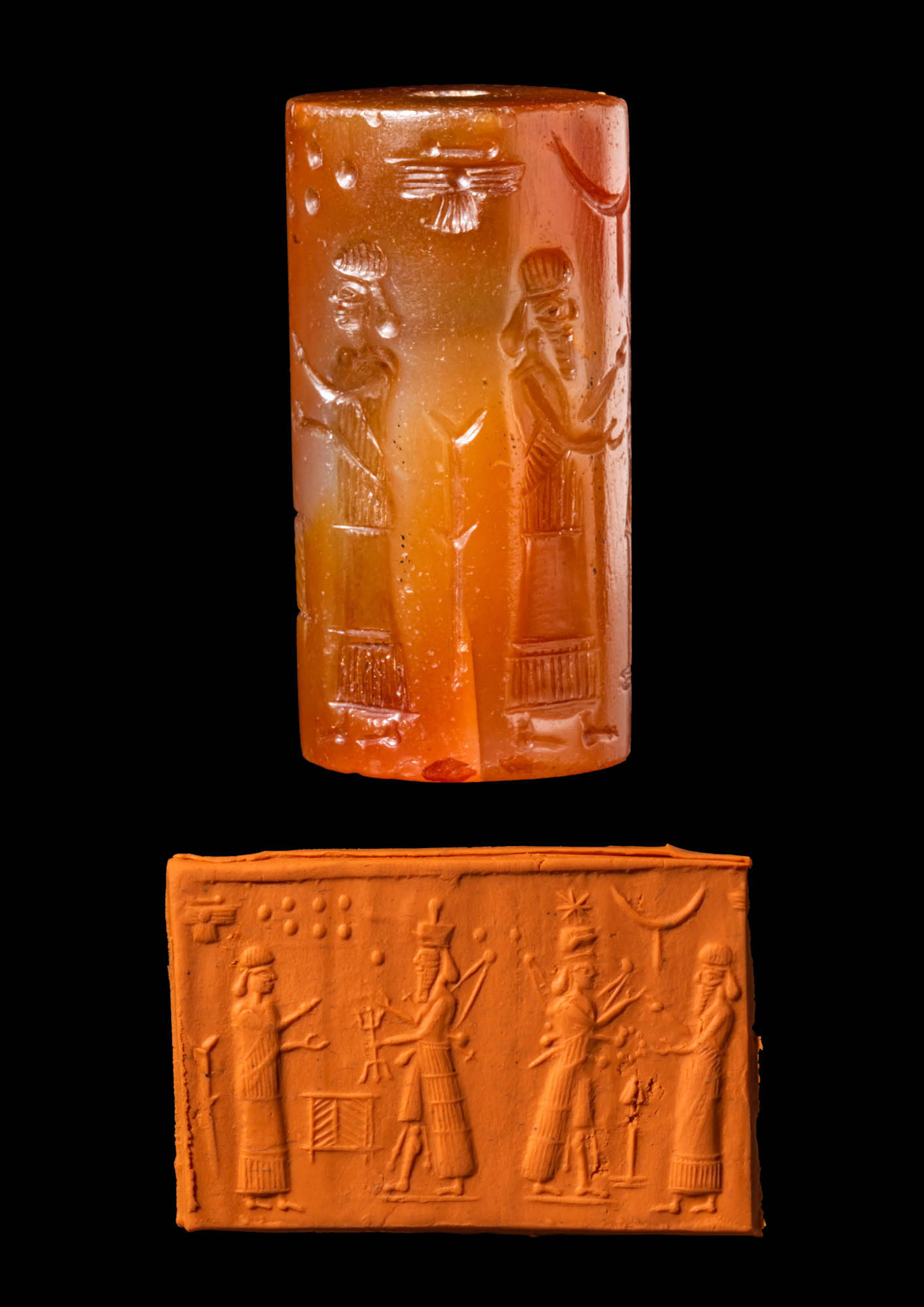 ASSYRO-BABYLONIAN CARNELIAN CYLINDER SEAL WITH WEATHER GOD