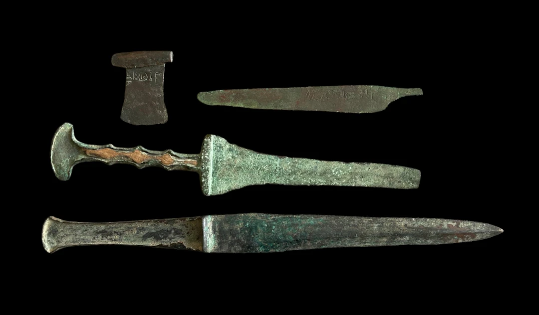 ANCIENT EGYPTIAN TEMPLE FOUNDATION DEPOSIT OF TWO DAGGERS, MODEL AXE