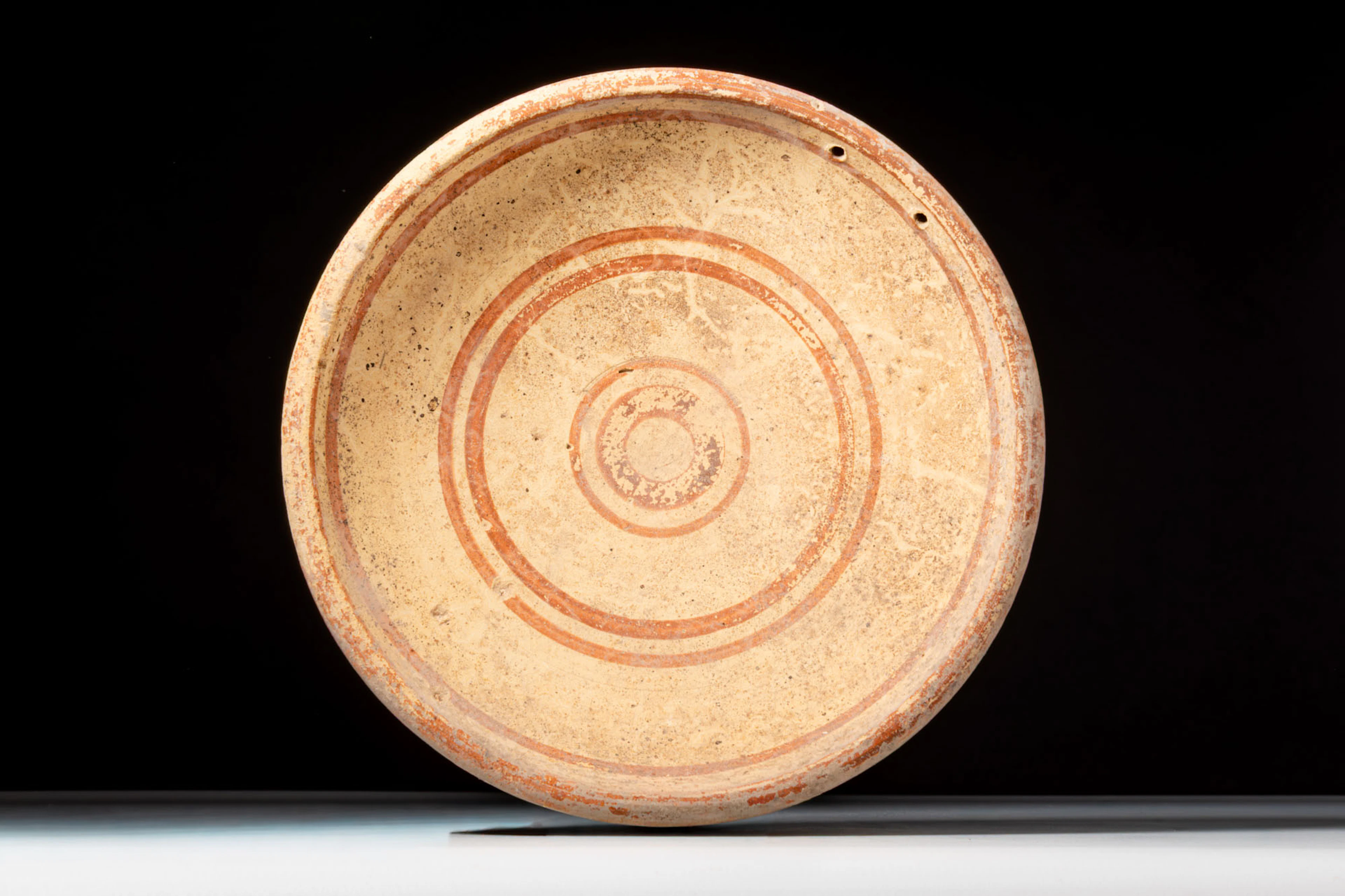 CYPRIOT TERRACOTTA DISH WITH RED PAINTED DECORATION
