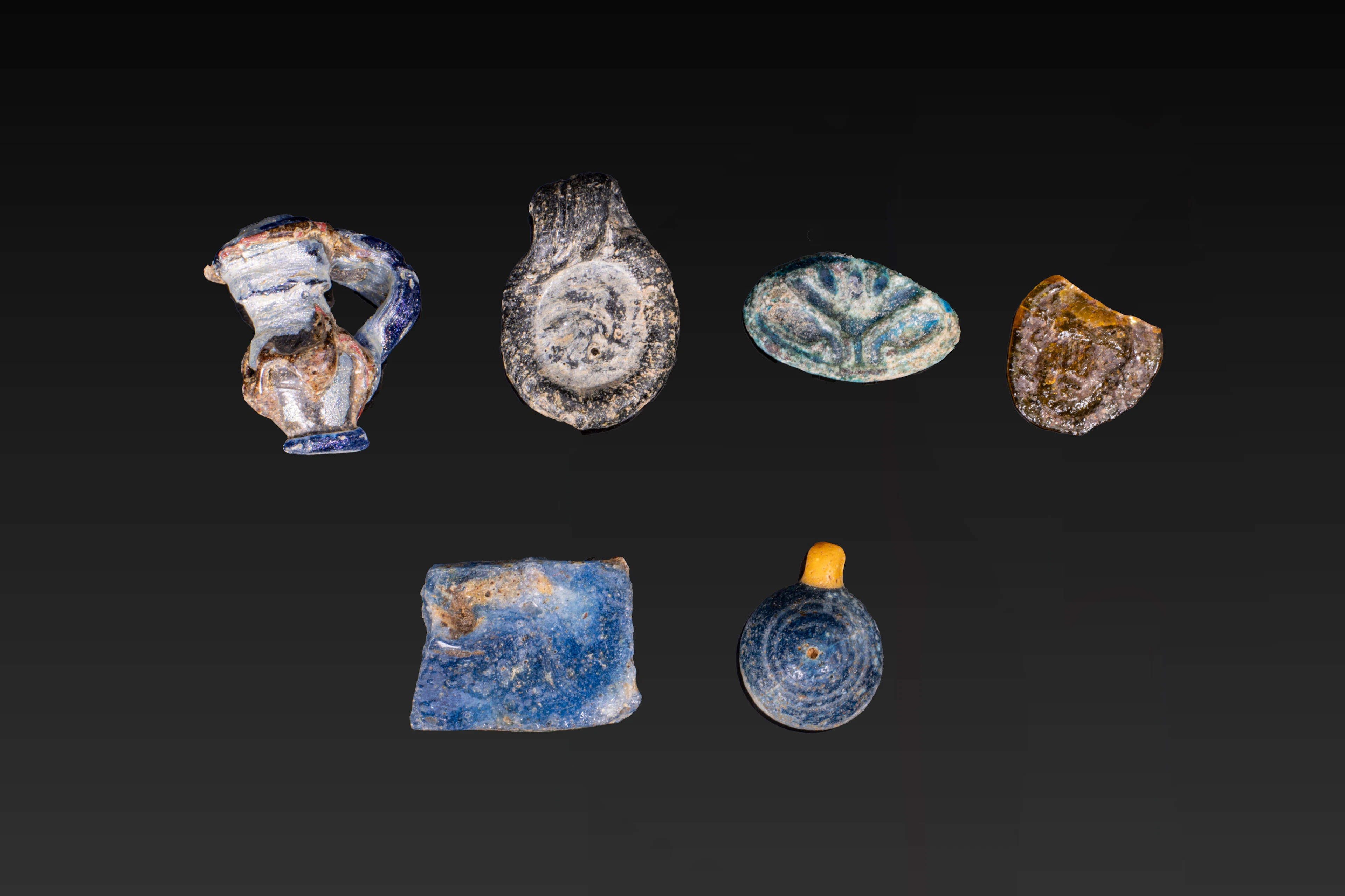 COLLECTION OF ROMANO-EGYPTIAN GLASS AMULETS