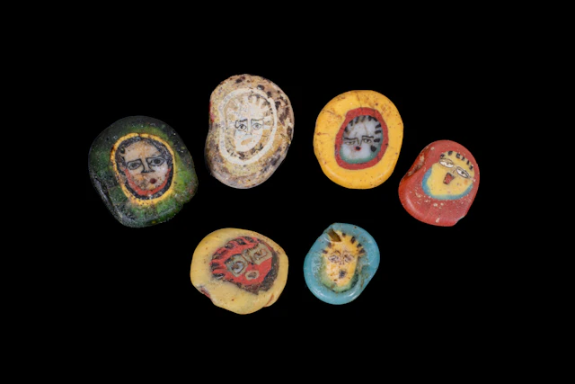 COLLECTION OF ROMAN MOSAIC GLASS BEADS WITH FACES