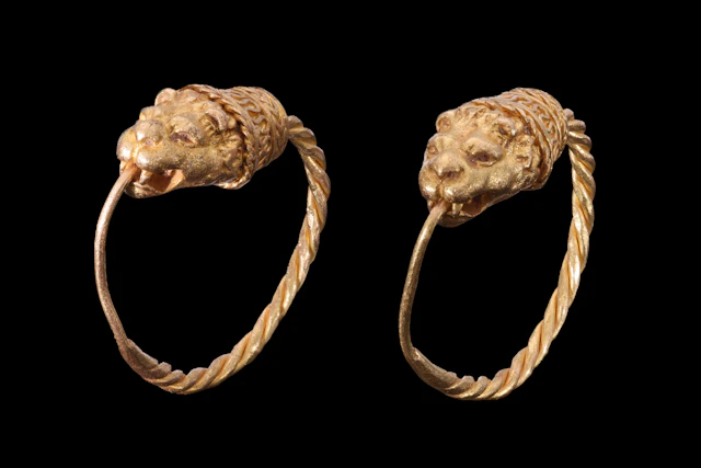MATCHED PAIR OF HELLENISTIC GOLD EARRINGS WITH EROS HEADS