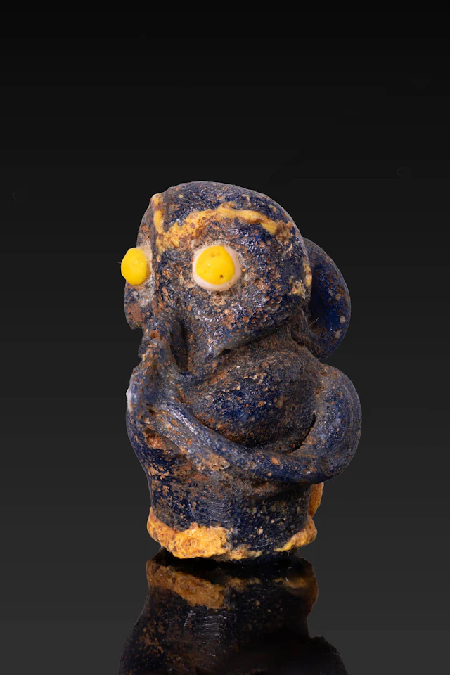RARE PHOENICIAN GLASS MONKEY-SHAPED PENDANT