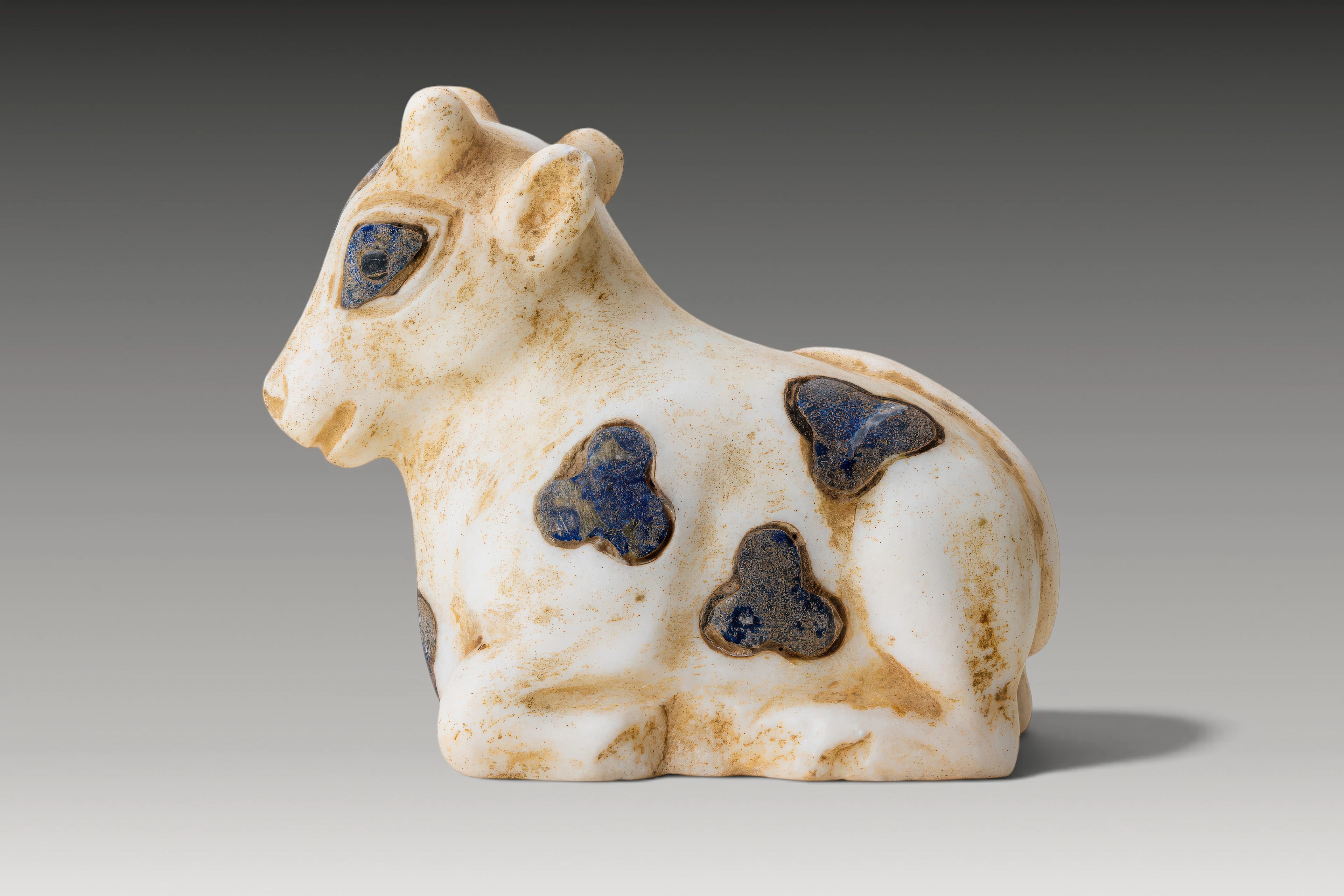 MESOPOTAMIAN MARBLE AND LAPIS LAZULI INLAID BULL OF HEAVEN IDOL