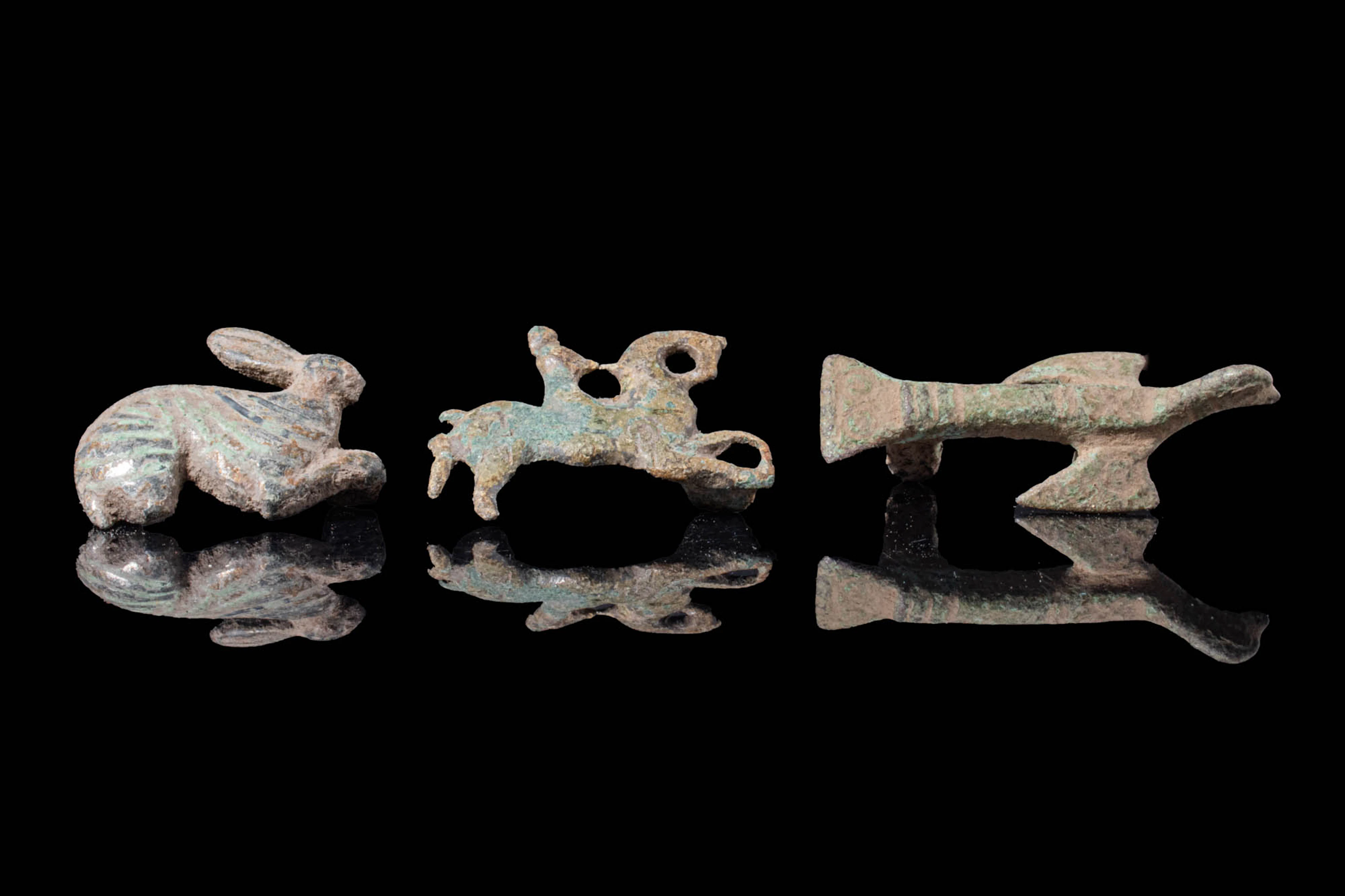 COLLECTION OF ROMAN BRONZE ANIMAL BROOCHES