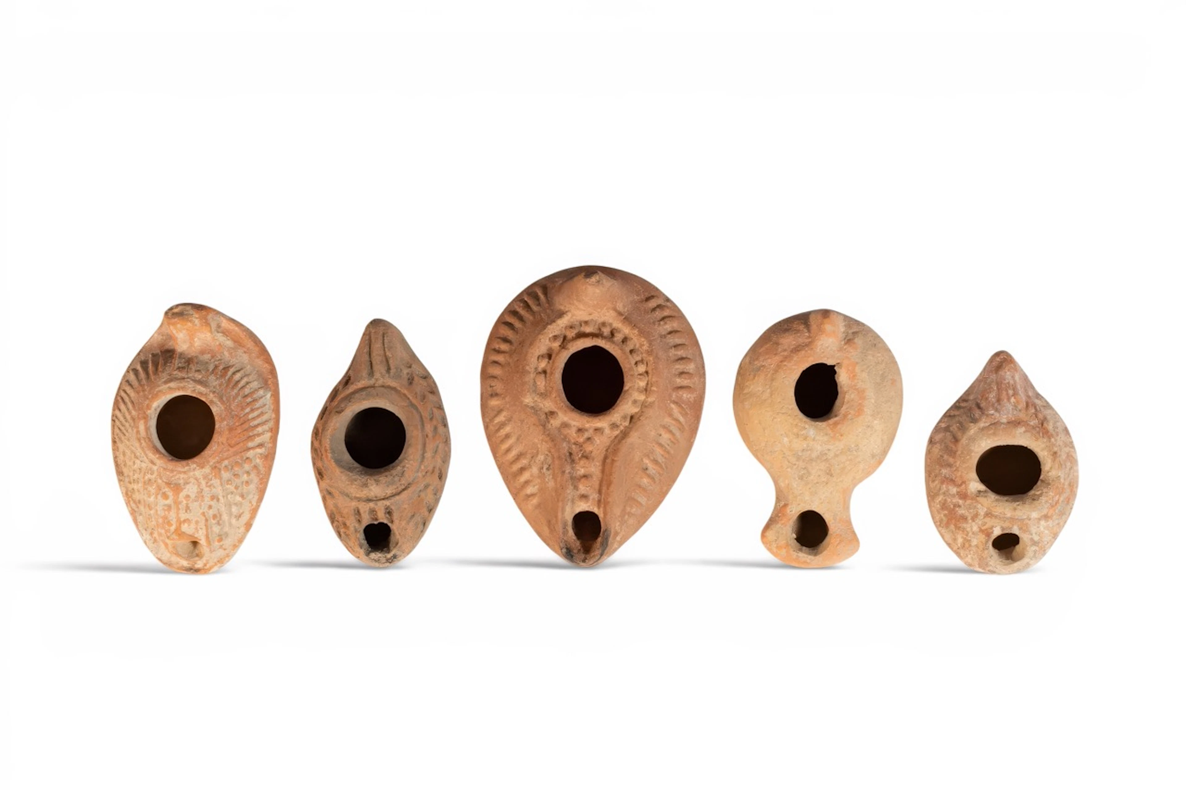 COLLECTION OF HELLENISTIC AND ROMAN TERRACOTTA OIL LAMPS