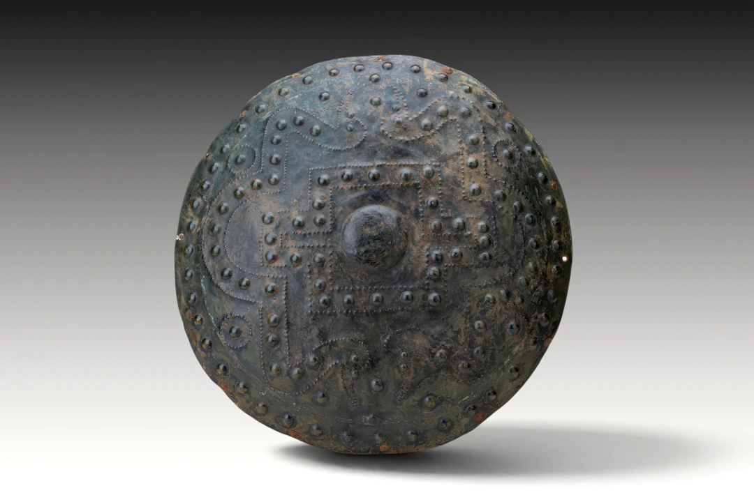 RARE ETRUSCAN GEOMETRIC BRONZE SHIELD WITH ORIGINAL IRON NAILS