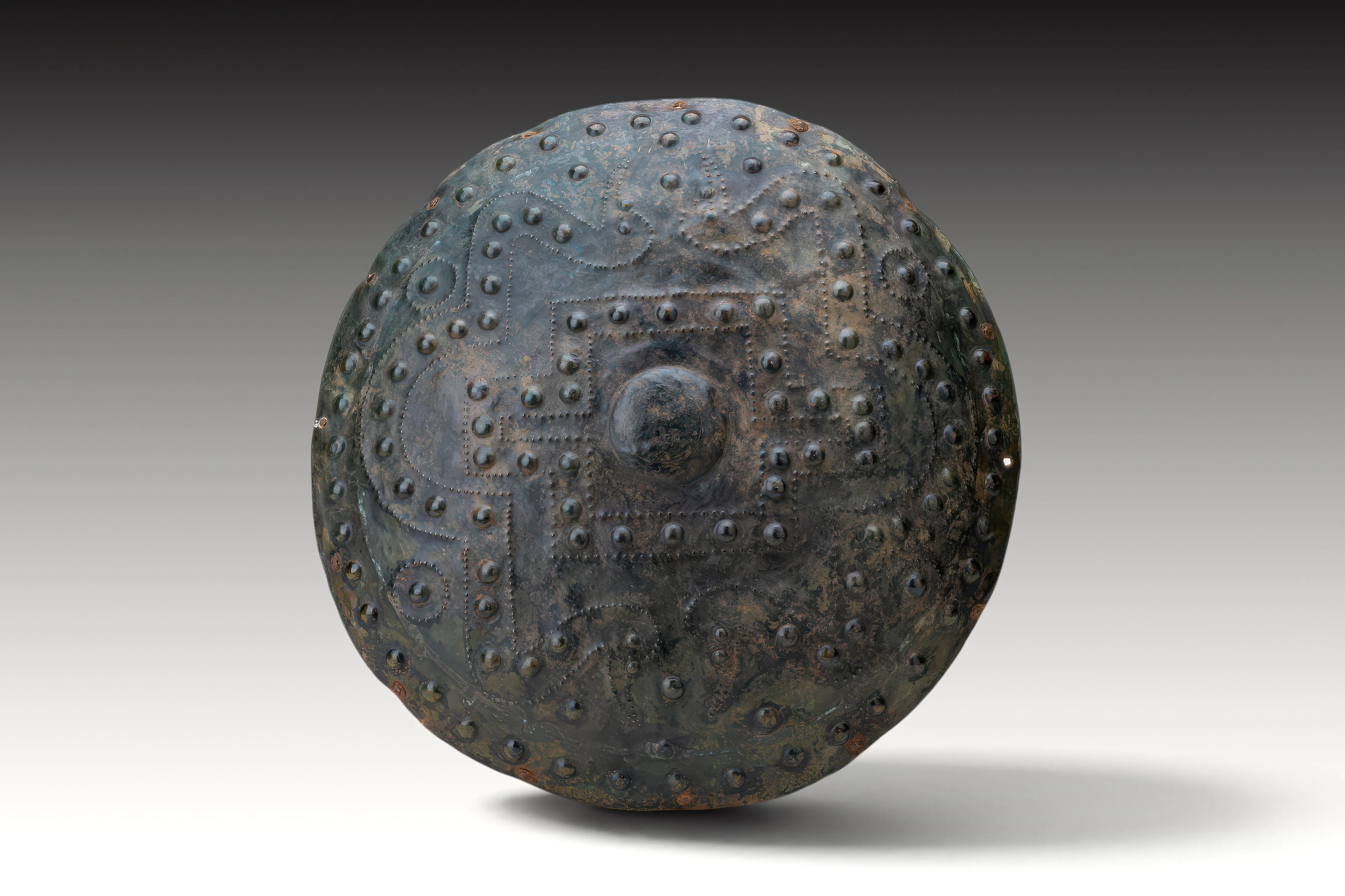 RARE ETRUSCAN GEOMETRIC BRONZE SHIELD WITH ORIGINAL IRON NAILS