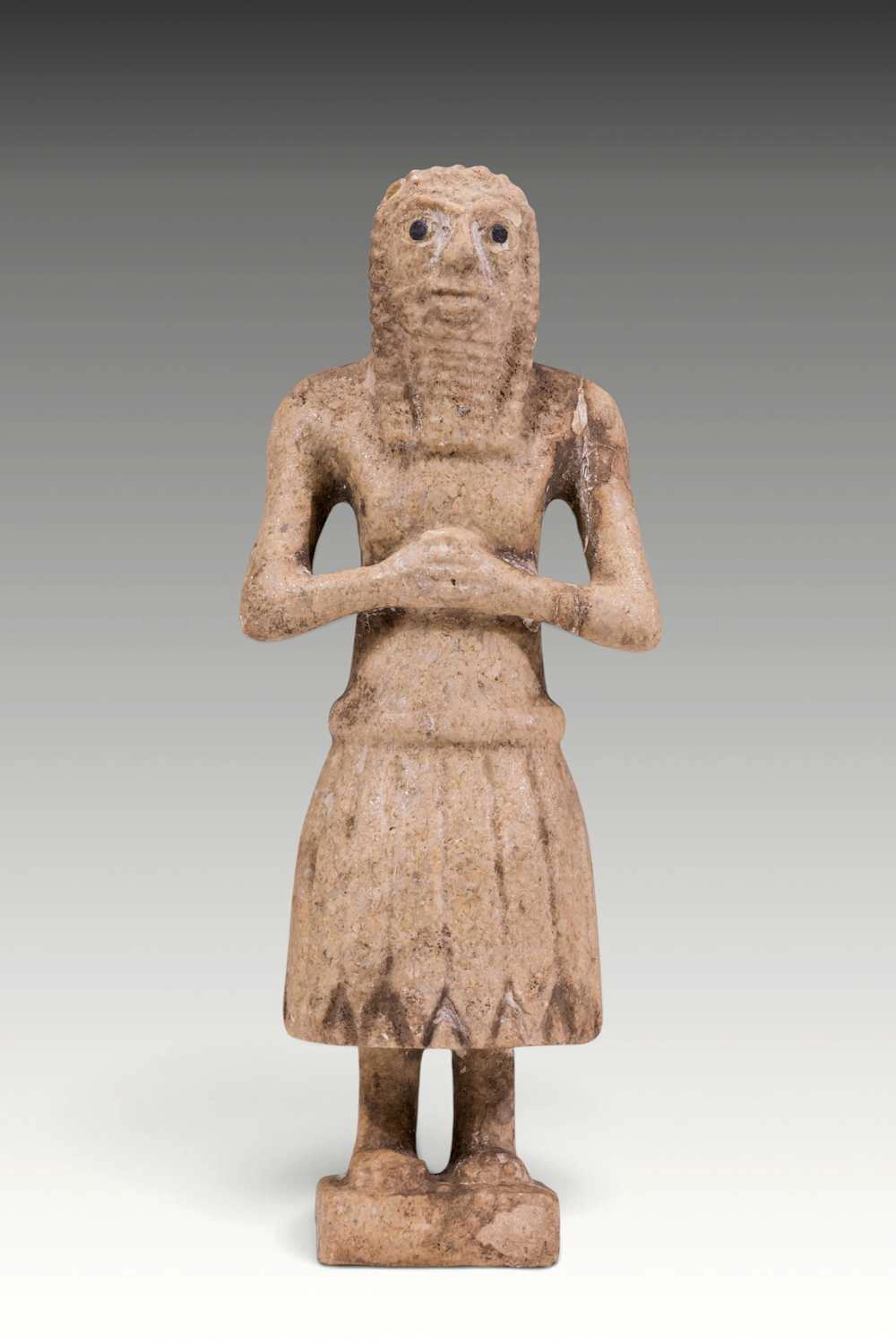 SUMERIAN MARBLE FIGURINE OF PRIEST WITH INLAID EYES