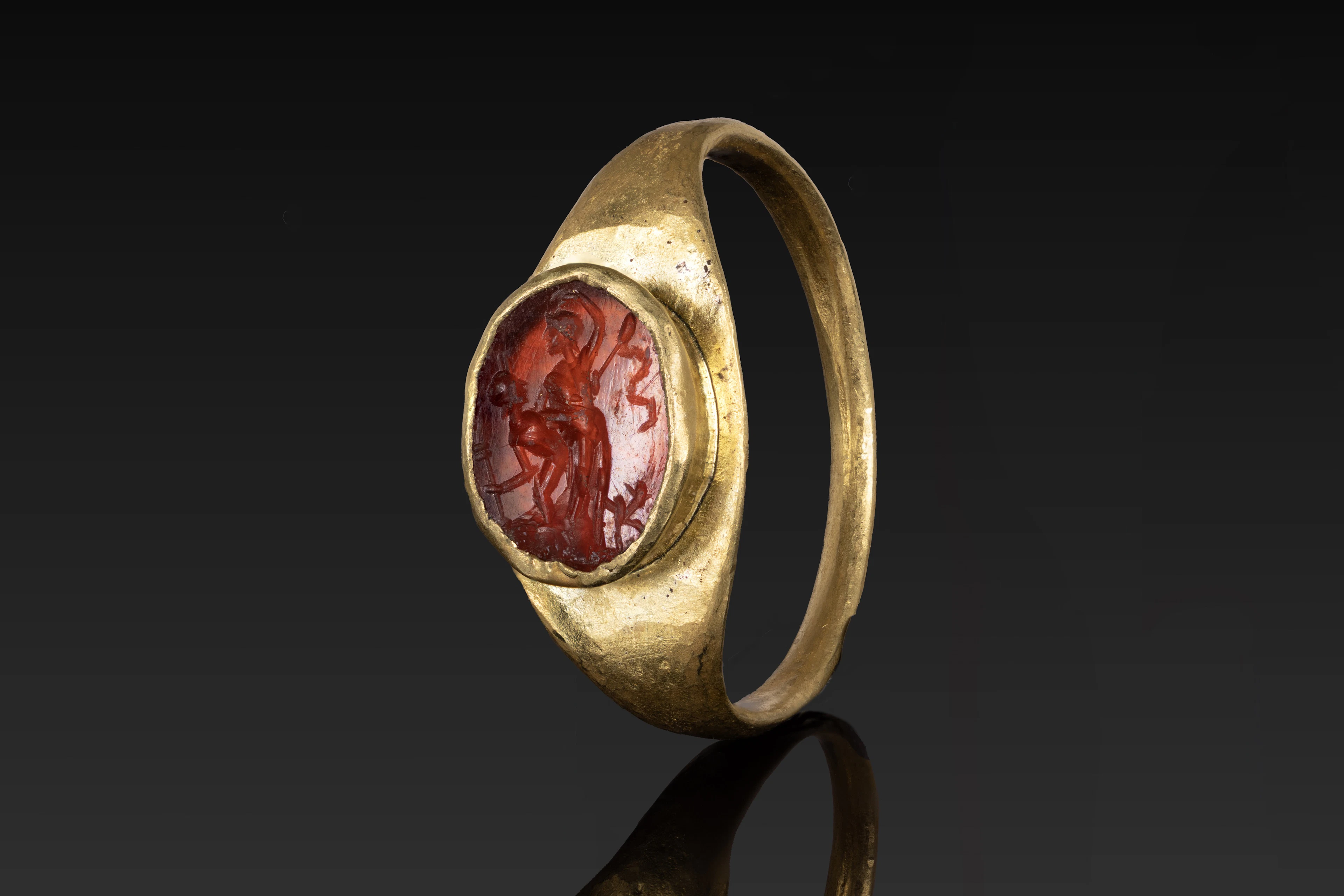 ROMAN CARNELIAN INTAGLIO OF DEITIES IN GOLD RING