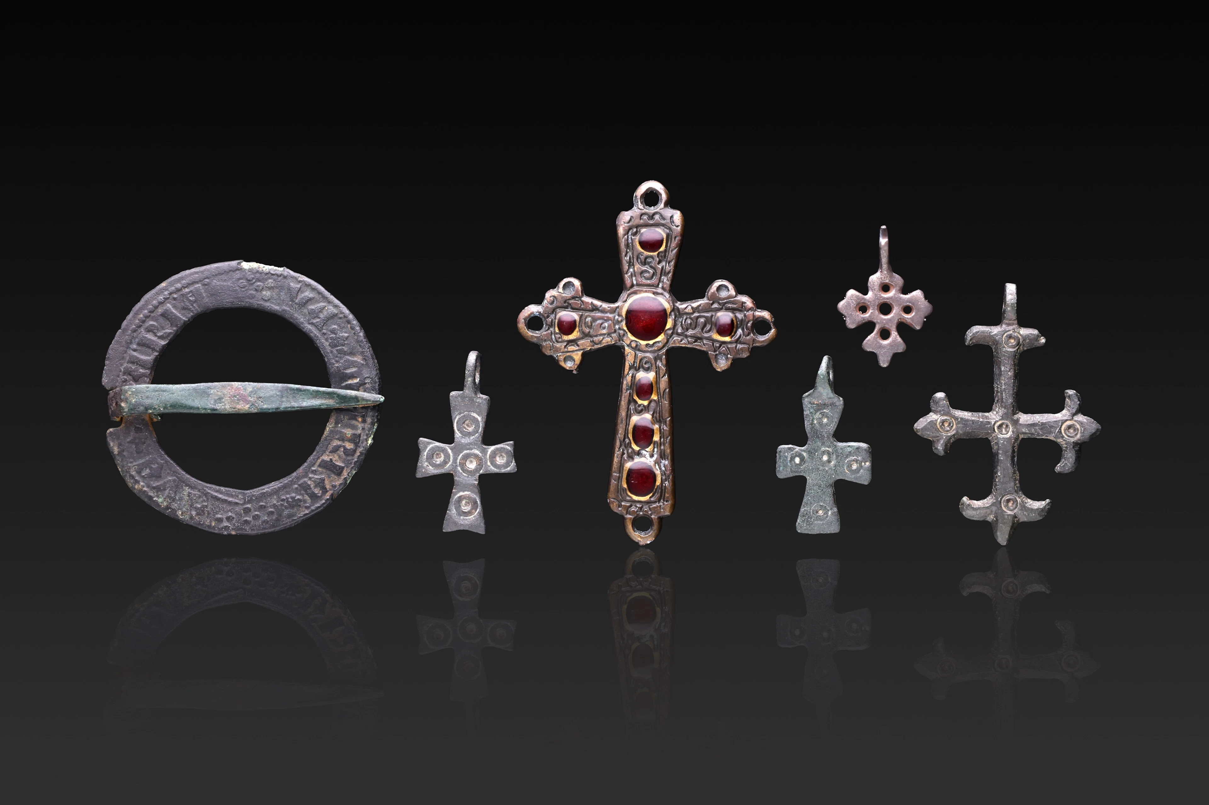 COLLECTION OF MEDIEVAL BRONZE CROSS PENDANTS, A GARNET-SET CROSS PENDANT