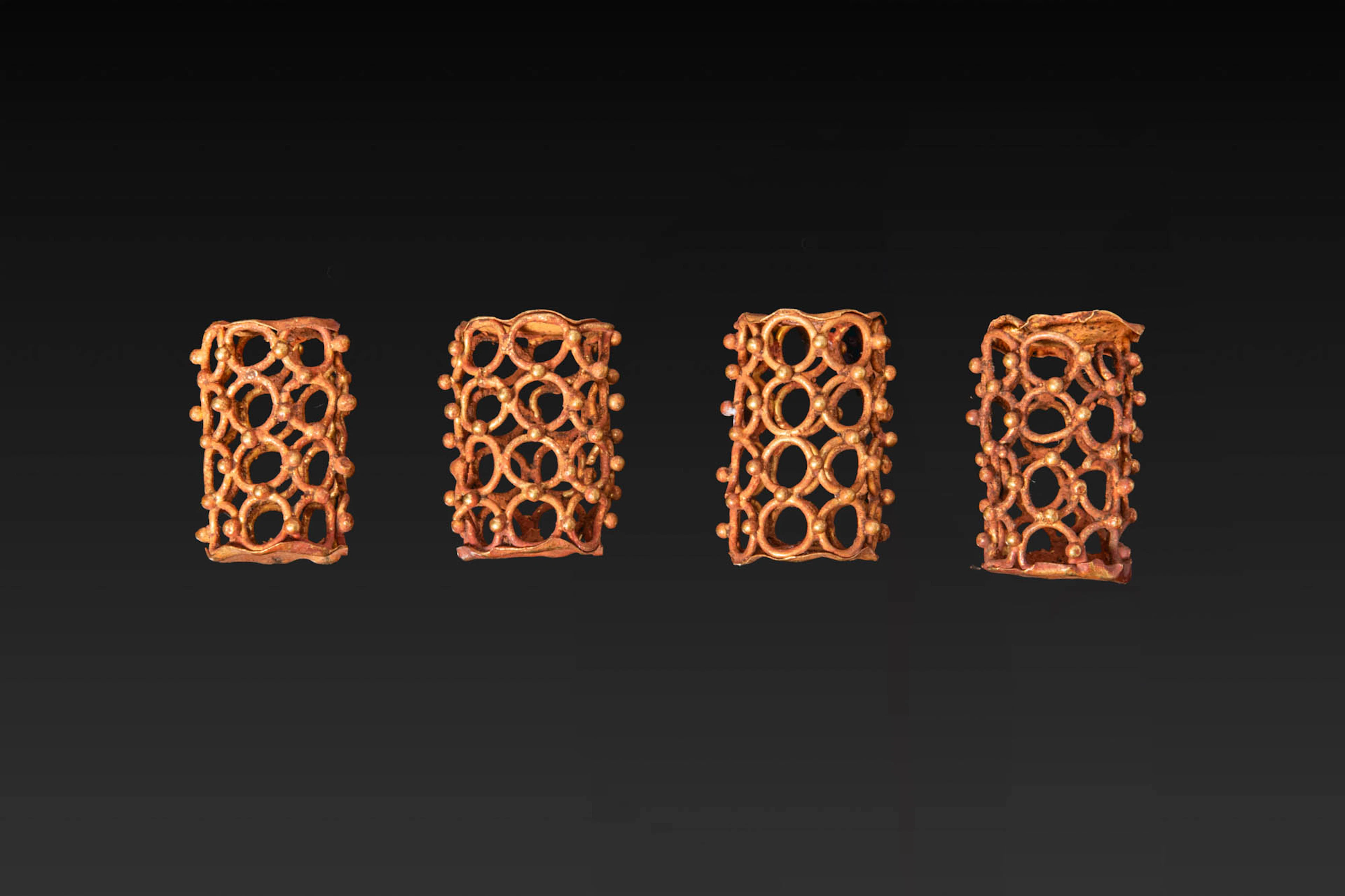 COLLECTION OF GREEK GOLD CAGE BEADS