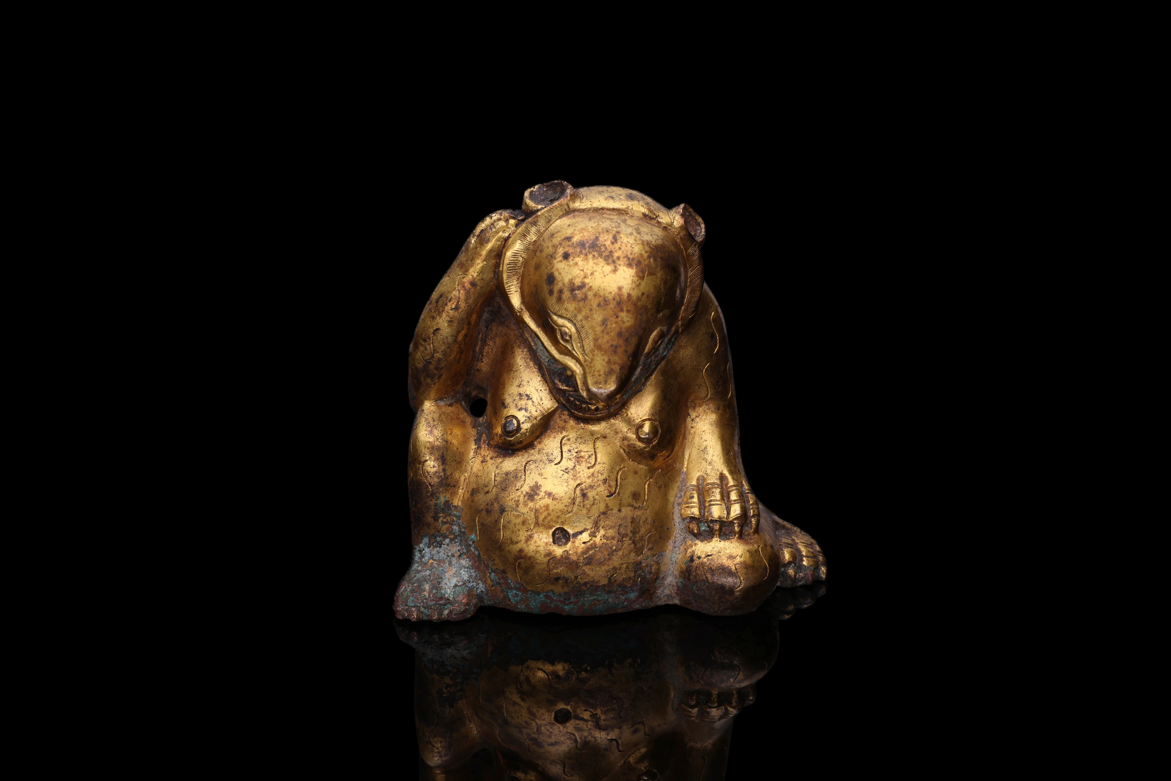 RARE GILT-BRONZE WEIGHT IN THE SHAPE OF A SEATED BEAR