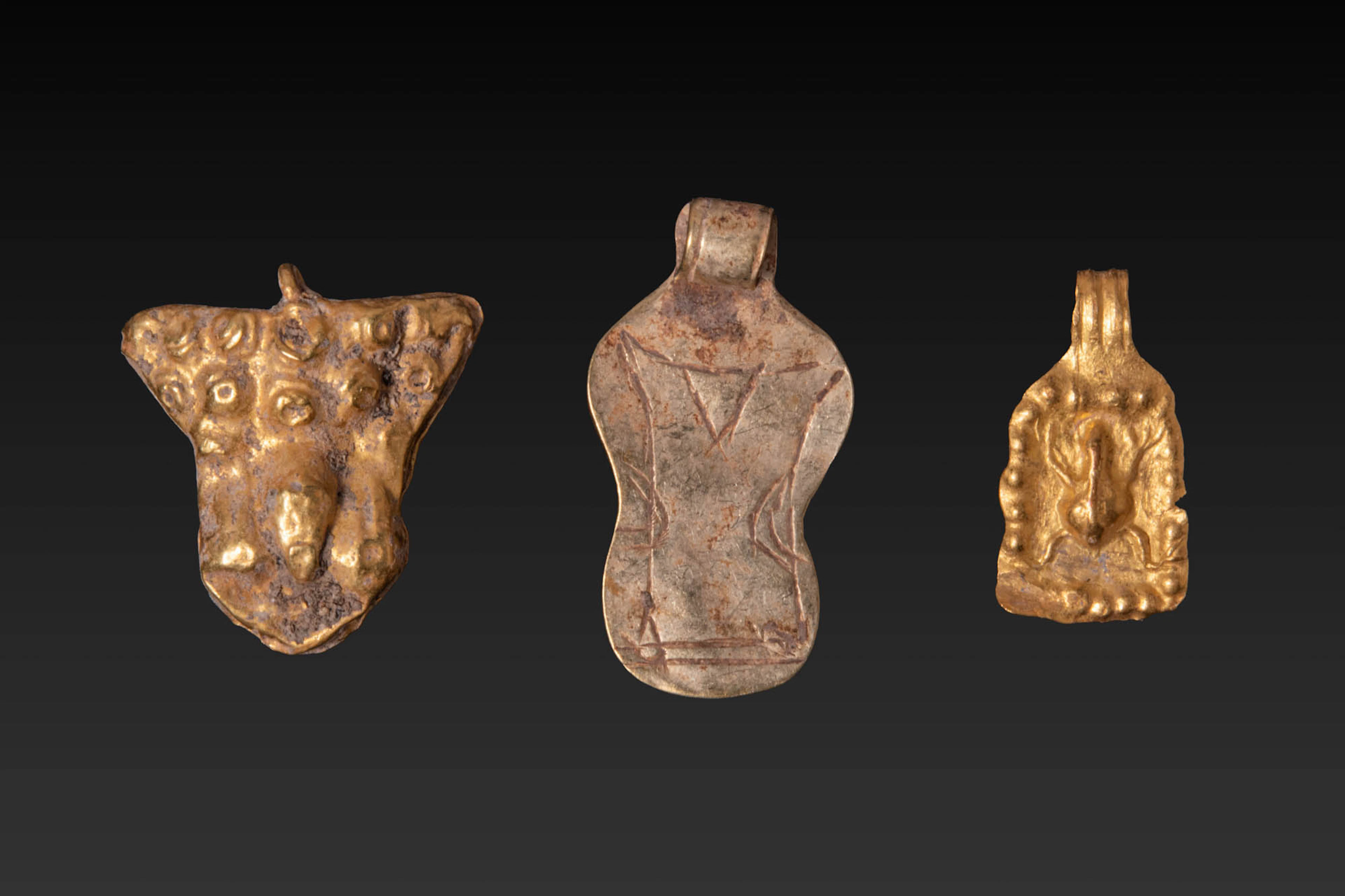 COLLECTION OF ROMAN HIGH KARAT GOLD AMULETS