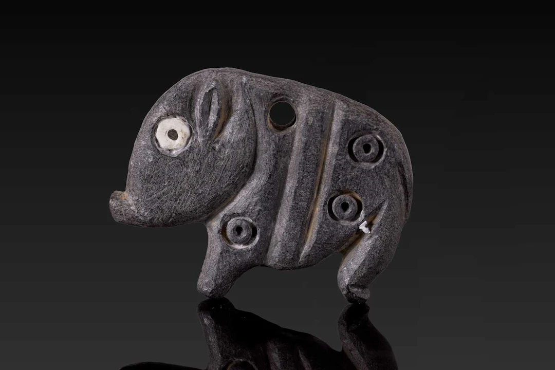 JEMDET NASR STONE AMULET IN THE FORM OF A HOG