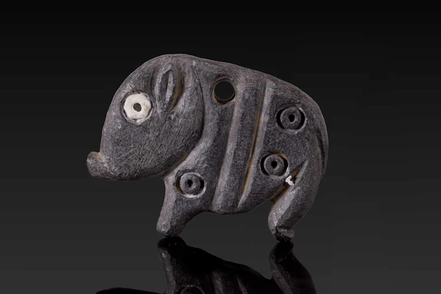 JEMDET NASR STONE AMULET IN THE FORM OF A HOG