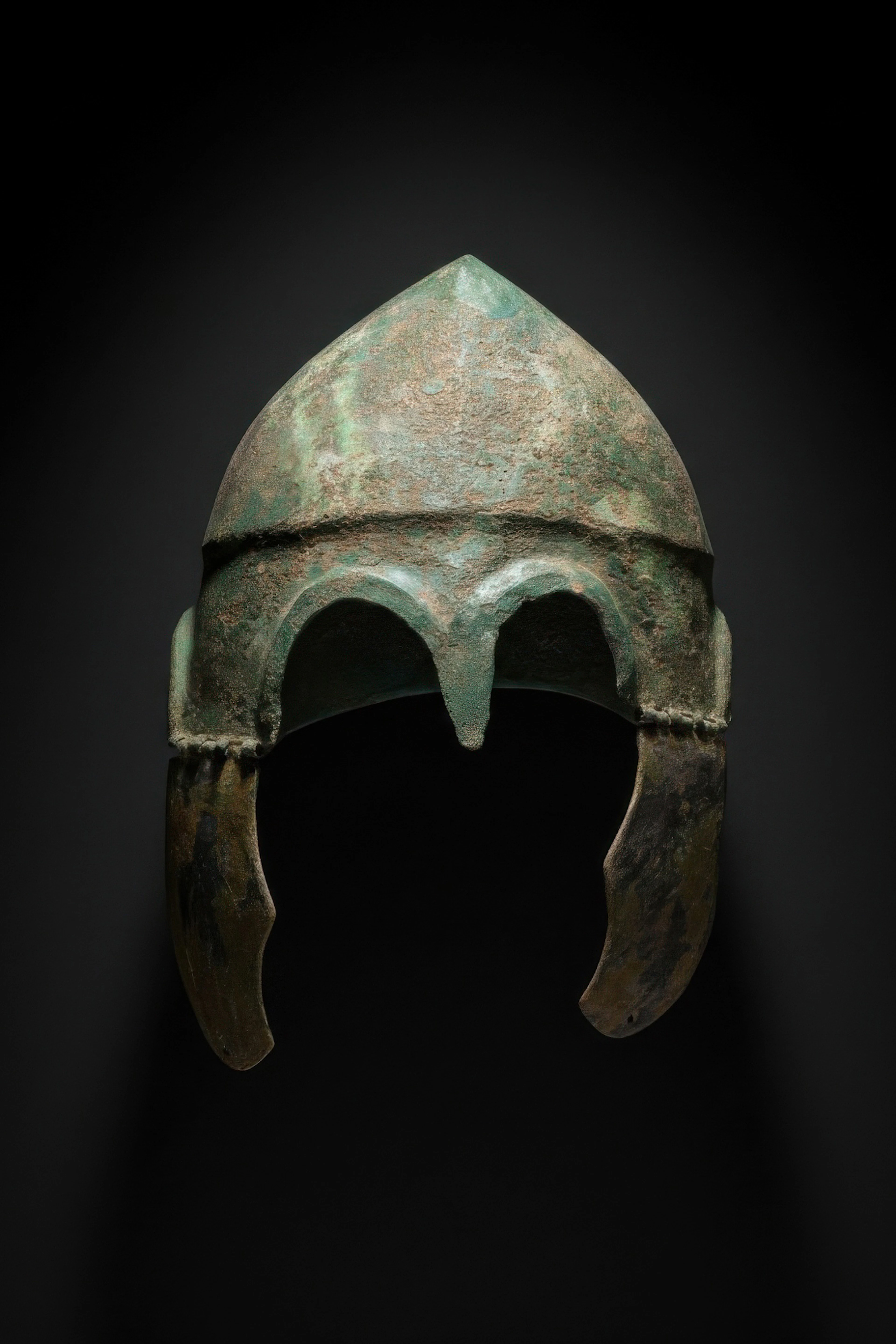 GREEK CHALCIDIAN TINNED BRONZE HELMET WITH CHEEK PIECES
