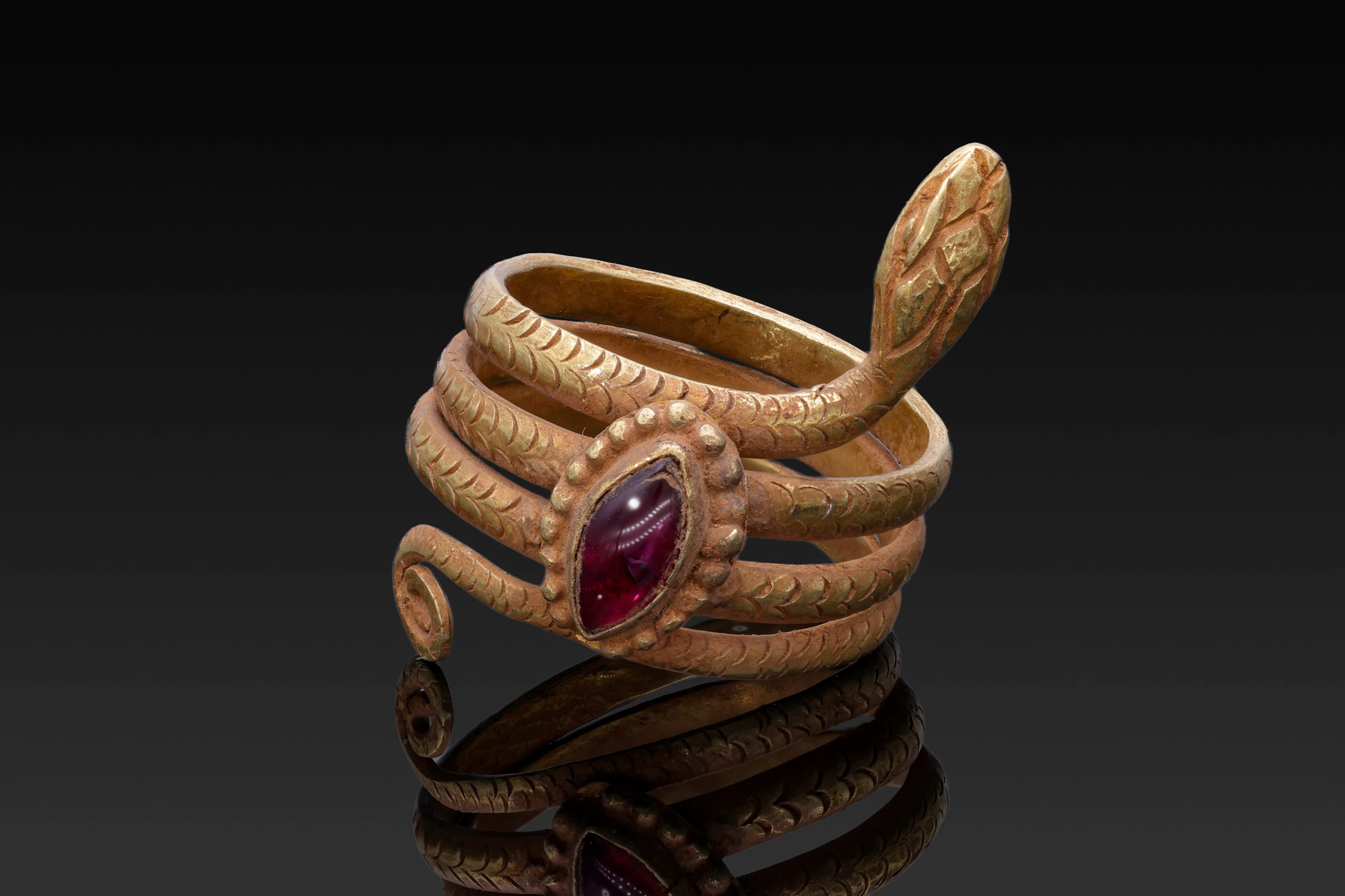 EGYPTIAN GOLD SNAKE RING WITH GARNET CABOCHON
