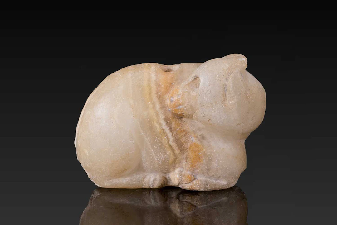 MESOPOTAMIAN STONE AMULET IN THE FORM OF A RECUMBENT BULL